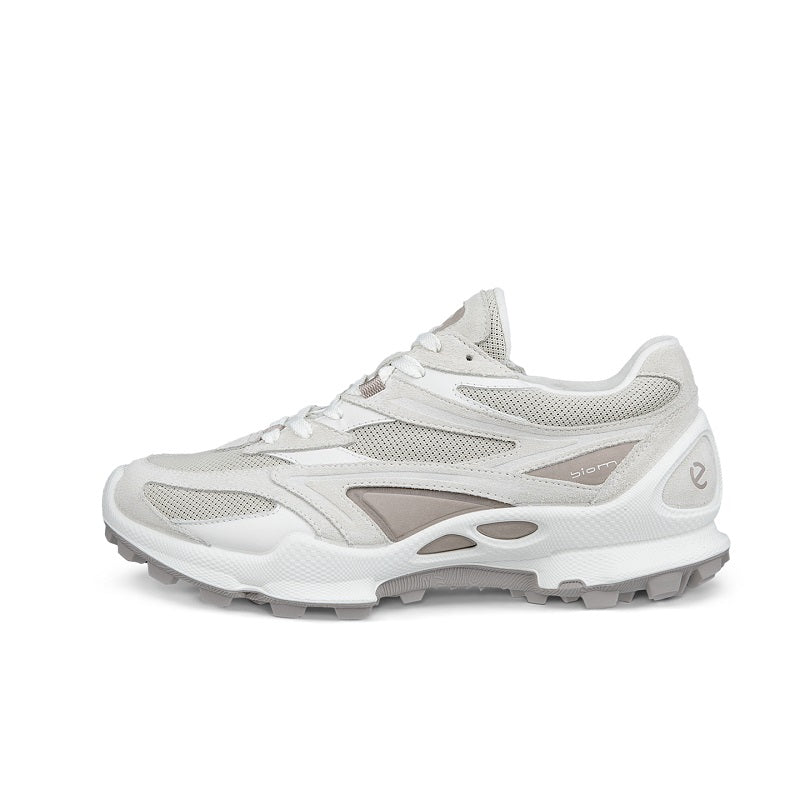 White women’s trail sneakers side view with lace-up front and light gray trim