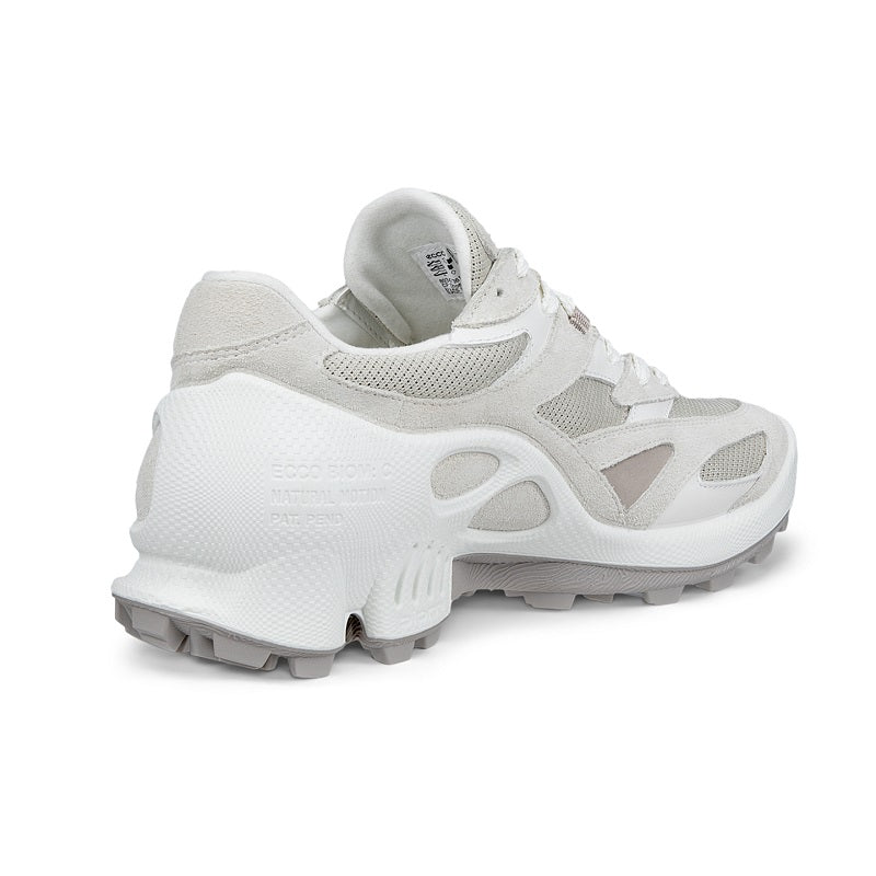 White women’s trail sneakers heel and side view with lace-up design and treaded outsole