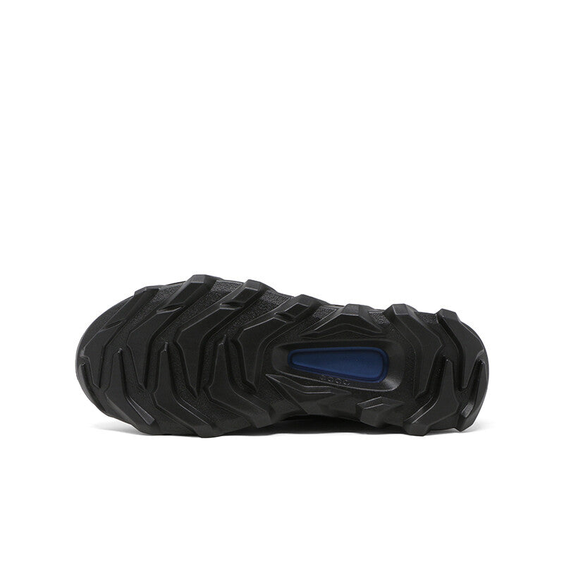 Black sneaker outsole with patterned traction lugs and blue oval insert