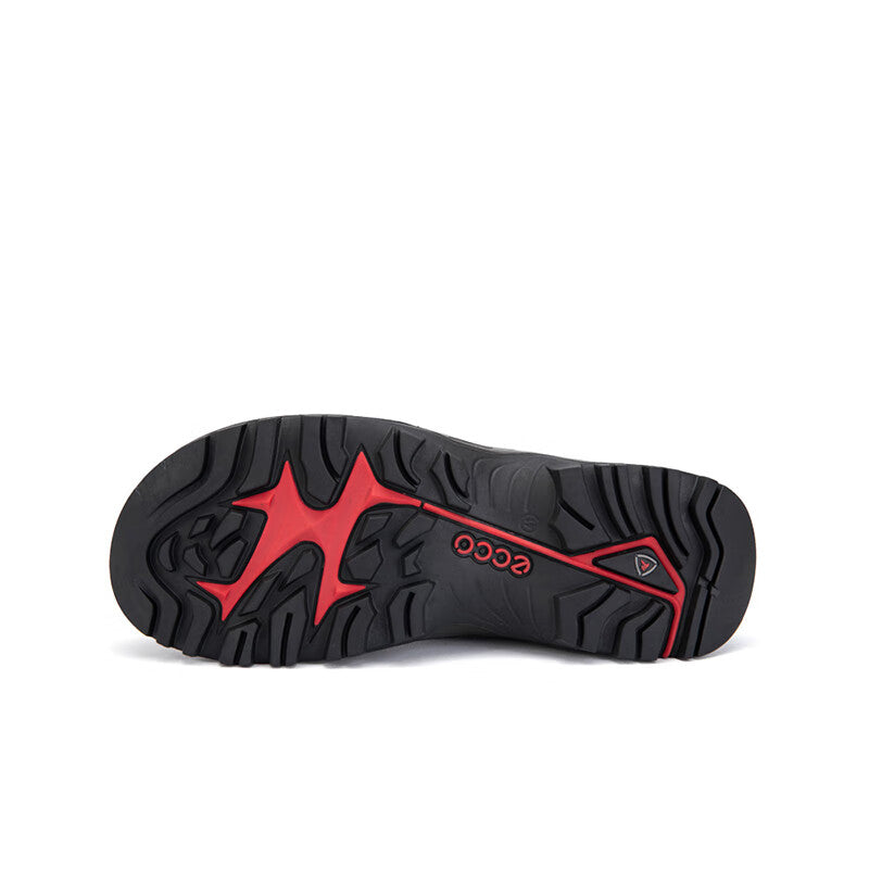 Men's off-road trainer outsole, black with red accent and deep tread pattern