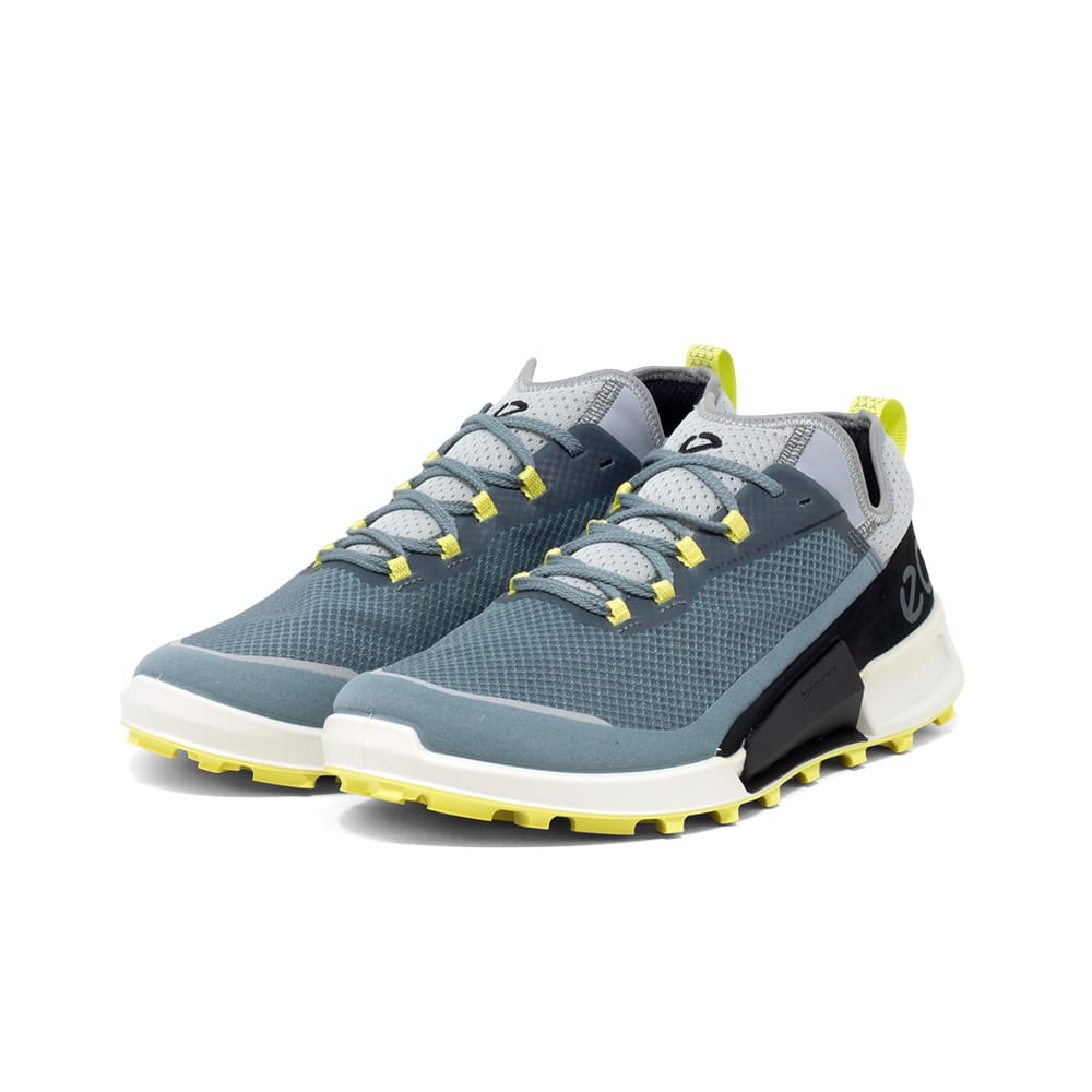 Men's blue trail sneakers with lace-up closure, neon accents, and treaded outsole
