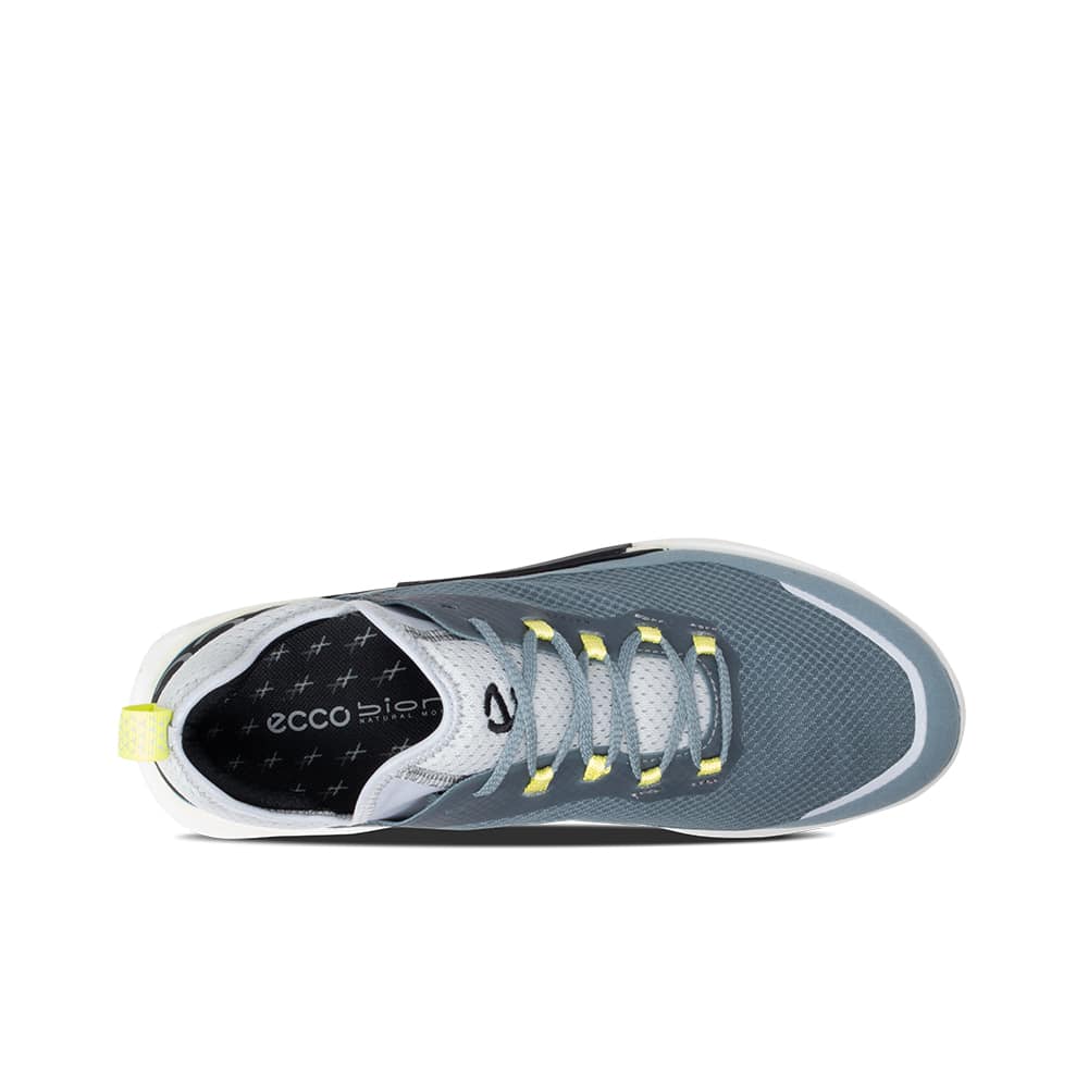 Men's blue trail sneakers with gray lining, lace-up front, and chunky sole