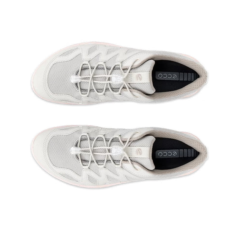 Light grey women's lace-up sneakers with dark sock liner and cushioned tongue