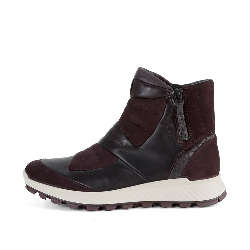 Burgundy and dark winter hiking boots with side zipper and white tread sole