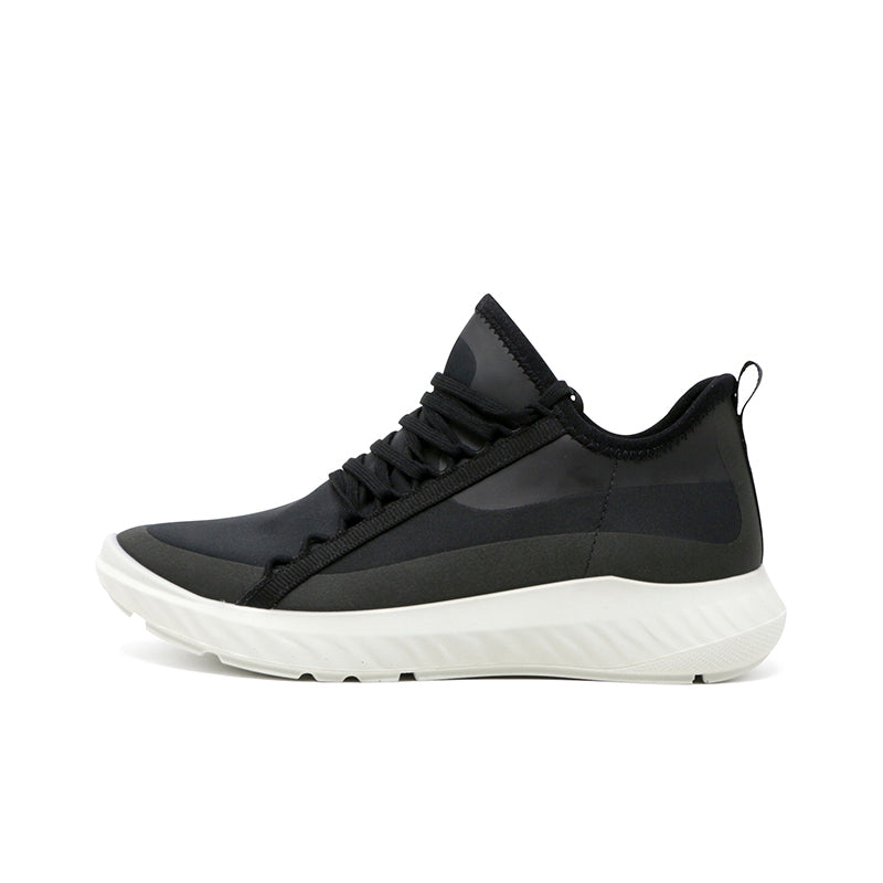 Black women's sneaker with lace-up front, sock-like collar, and white outsole
