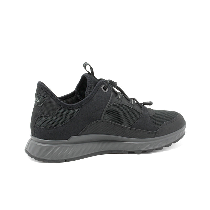 Black women's sneaker with lace-up front, mesh-like upper, and grippy rubber sole