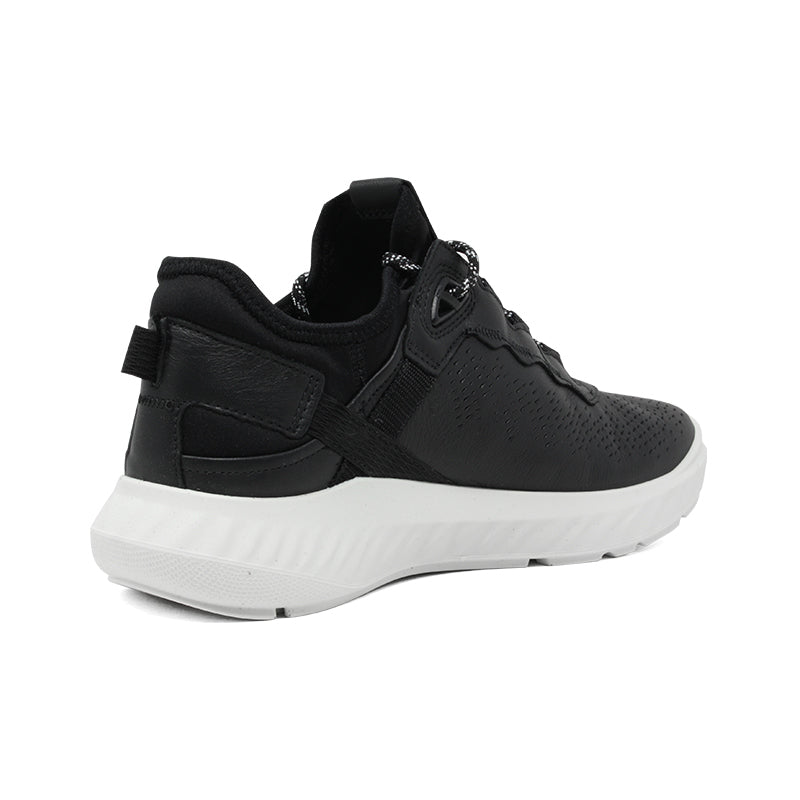 Women’s black leather sneakers with heel pull tab, side strap, and cushioned collar