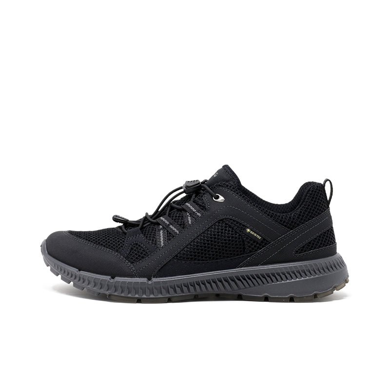 Black lace-up women’s sneakers with textured upper and treaded rubber sole