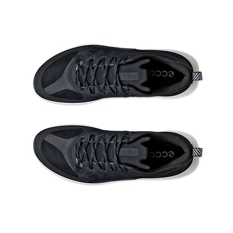 Black lace-up sneakers, close-up of mesh upper and white outsole side view