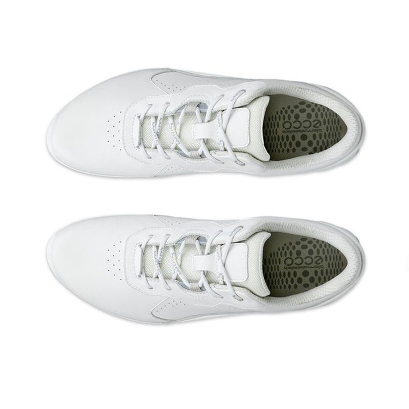 Pair of white lace-up womens sneakers, inside lining detail visible