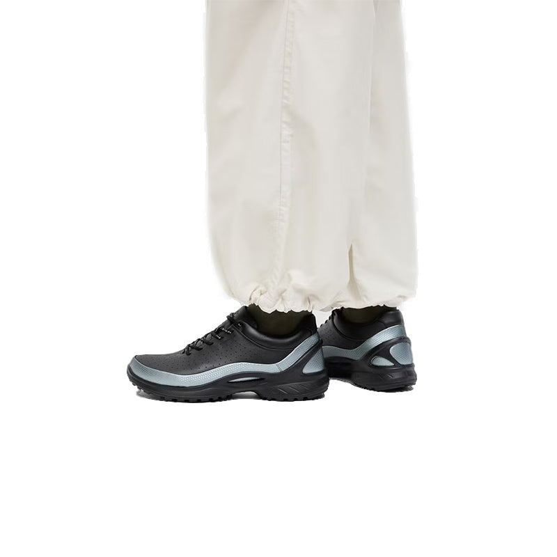 Black and gray lace-up sneakers with perforated uppers and cushioned sole