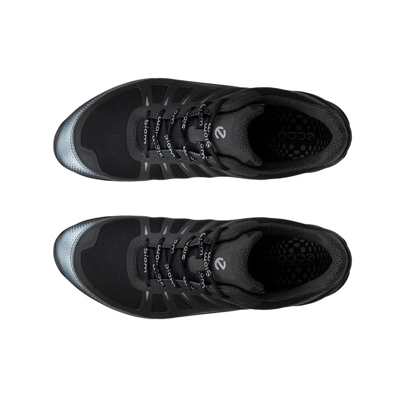 Pair of black lace-up sneakers shown from above with open padded tongue