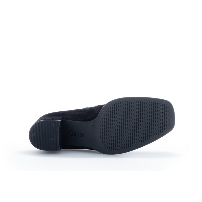 Women’s black ankle boots with logo sole and textured rubber outsole