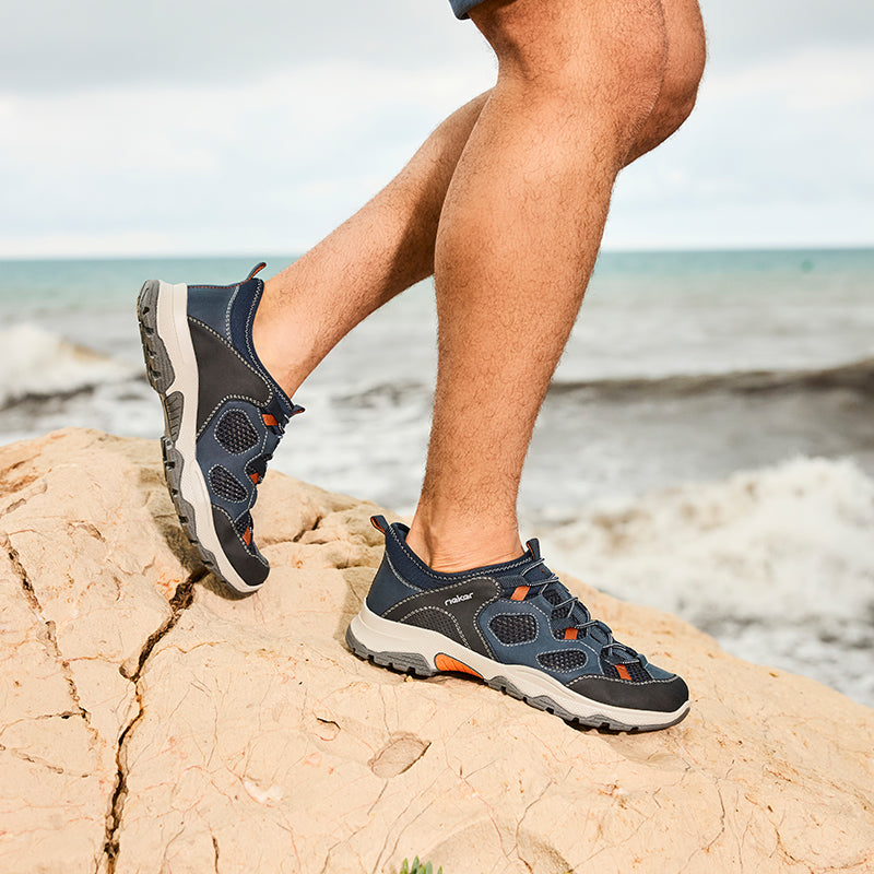 Men's Rieker slip-on sneakers in blue with orange accents and grippy outsole