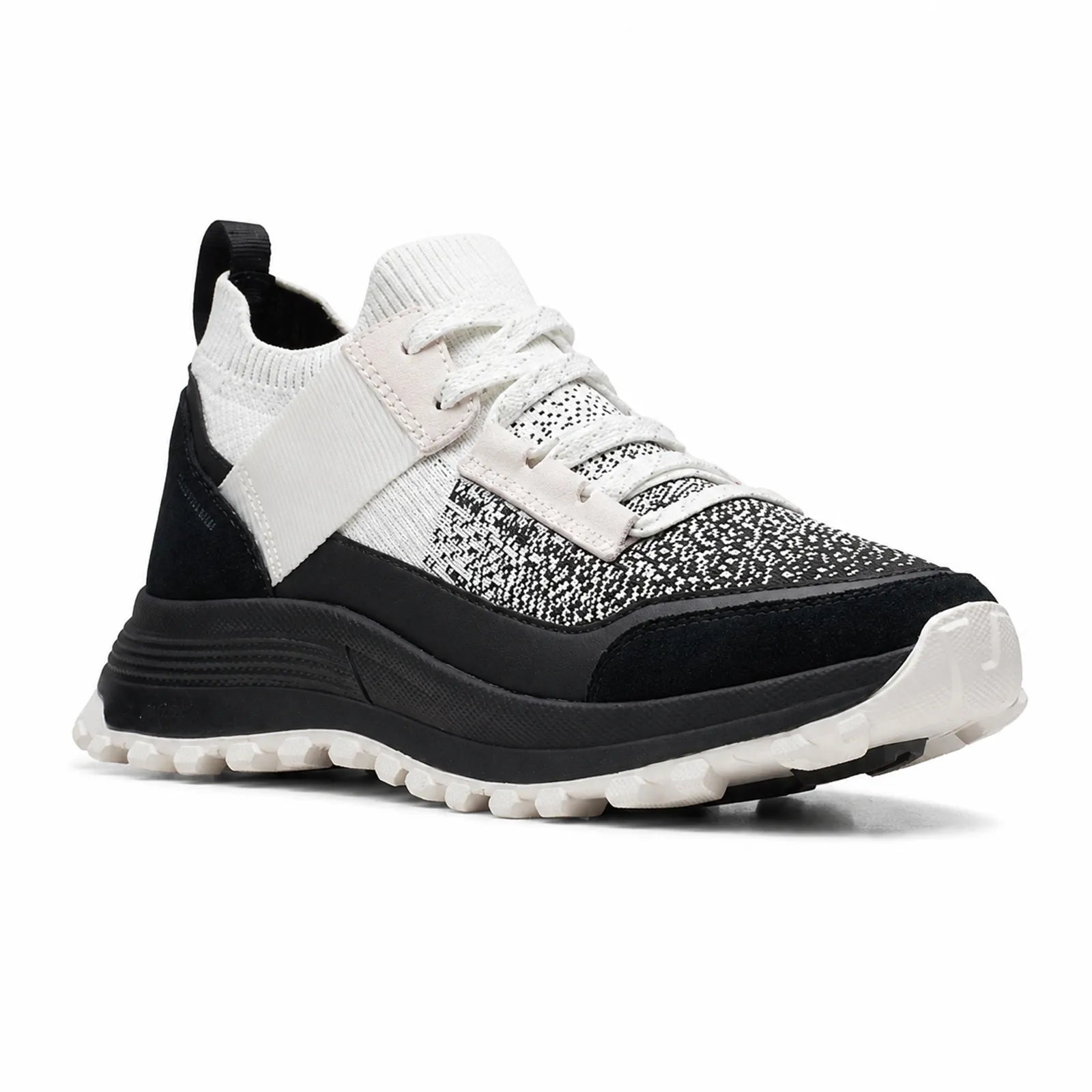 Women’s lace-up knit sneaker in white and black with a chunky treaded sole