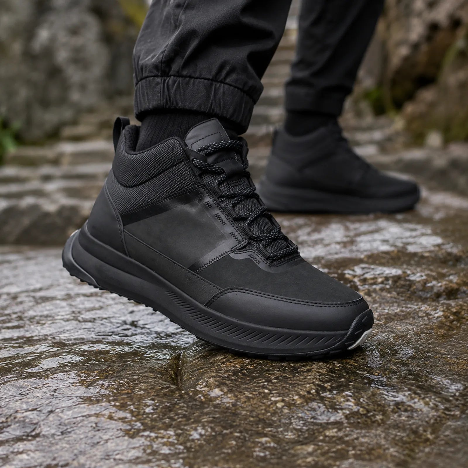 Black TrailUp WP sneaker close-up with textured upper and thick tread sole