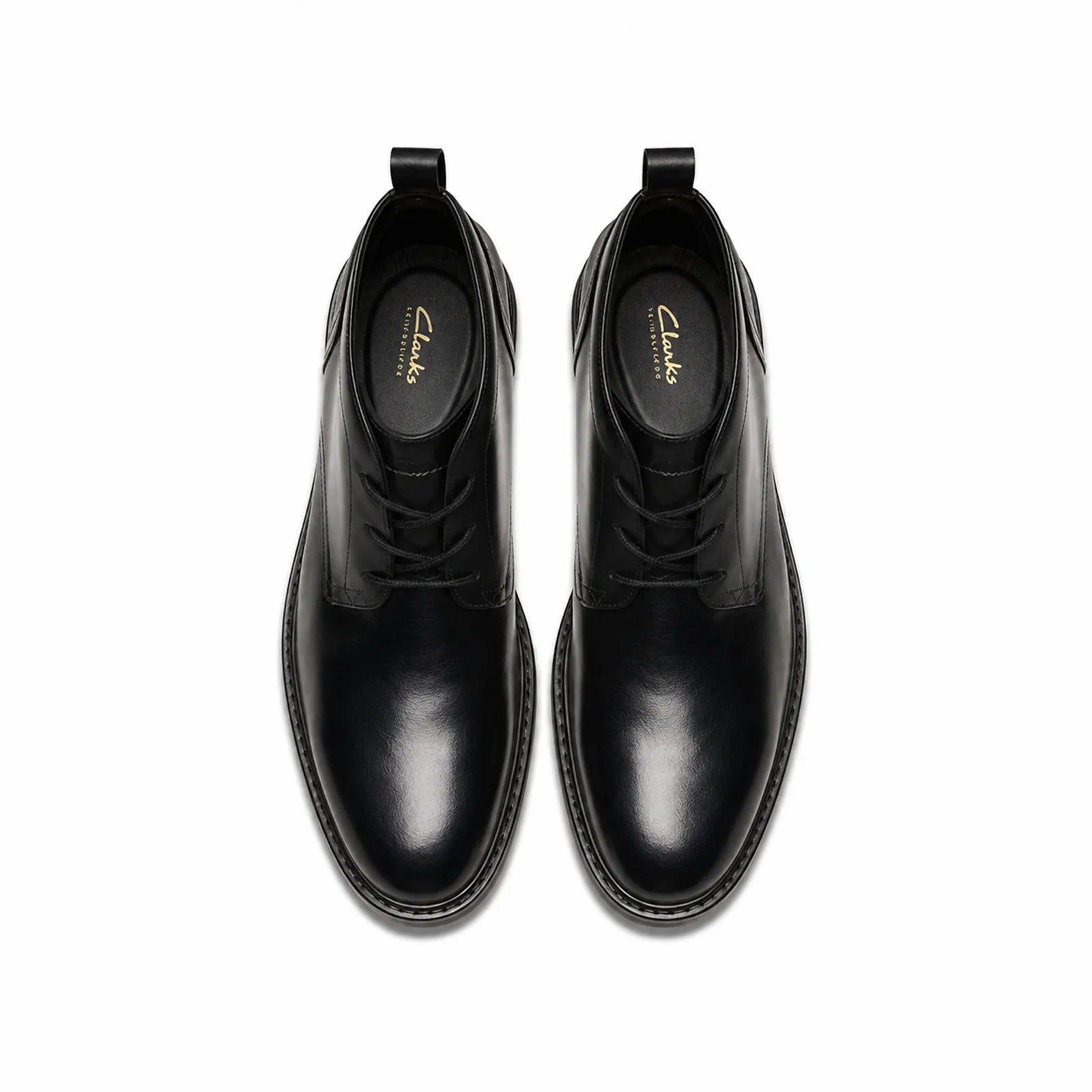 Pair of men's black leather chukka boots, front view with lace-up tops