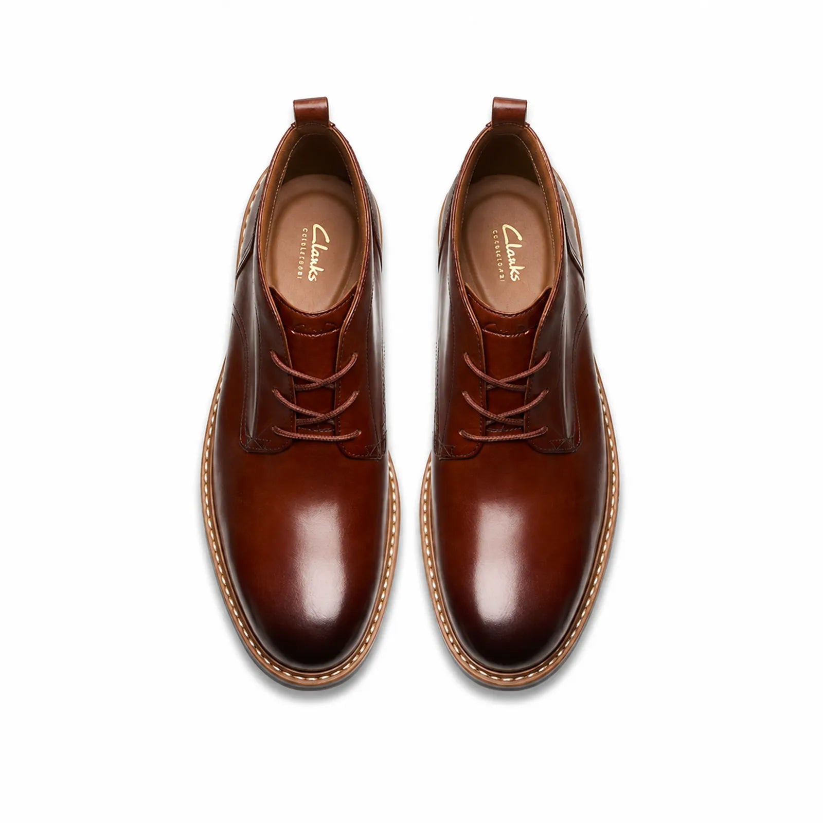 Pair of men's brown leather chukka boots, top view showing lace-up fronts
