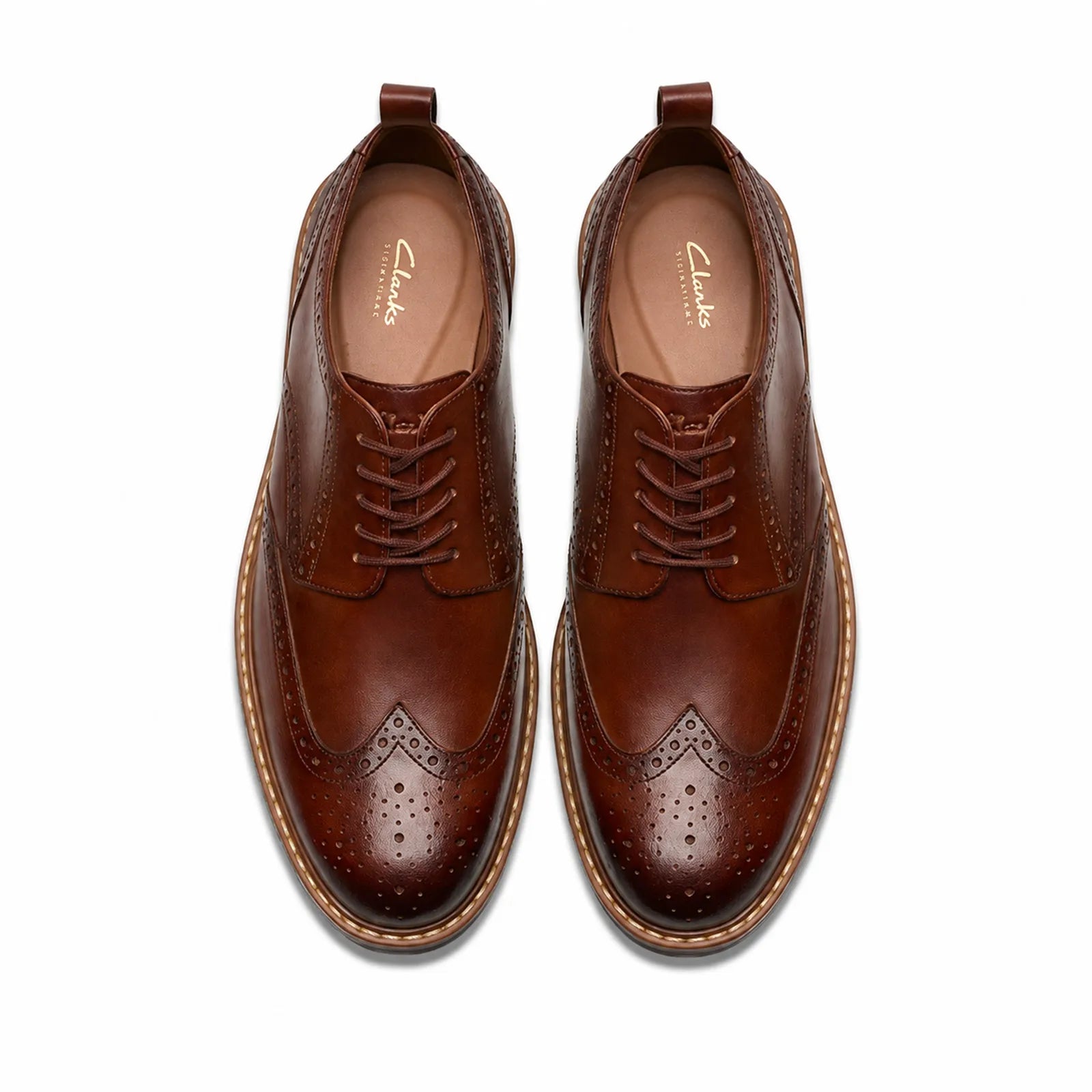 Pair of brown leather lace-up dress shoes with brogue detailing and cushioned lining