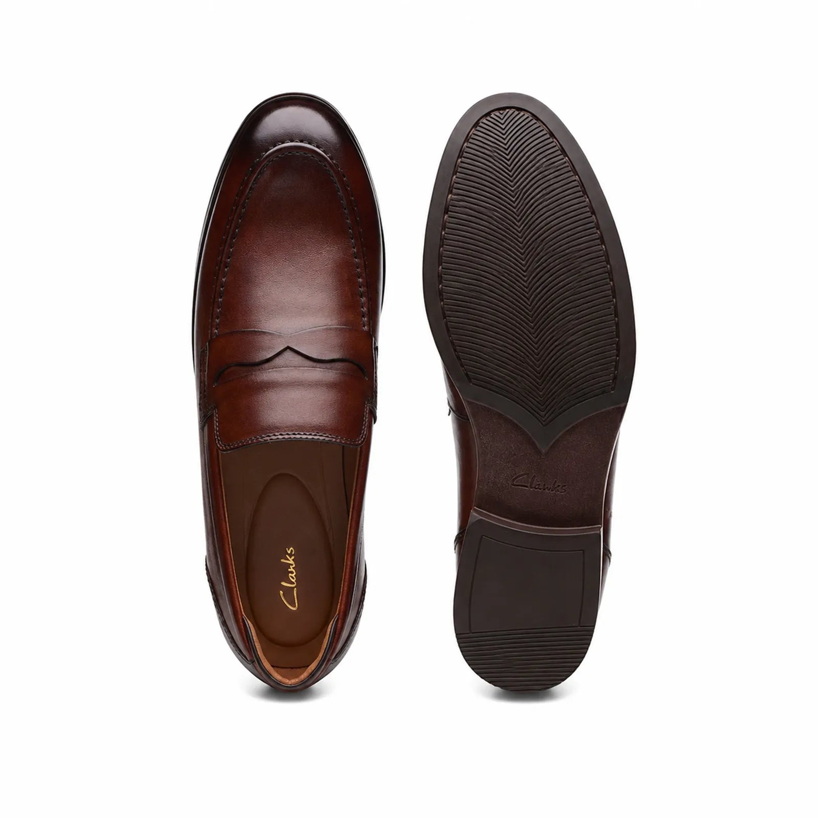 Brown leather loafer pair view with stitched vamp and textured rubber outsole