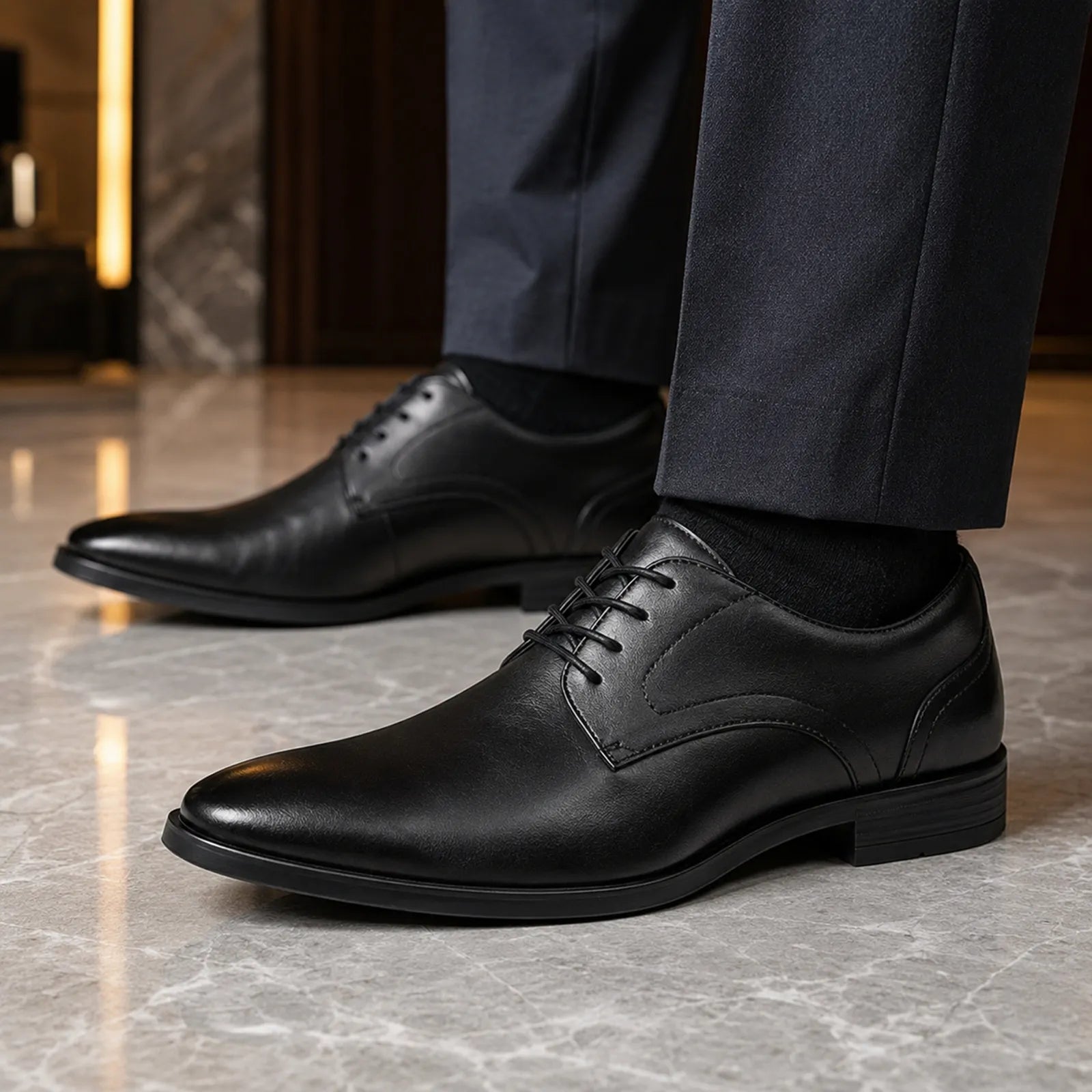 Men's black leather lace-up dress shoes with smooth upper and black laces