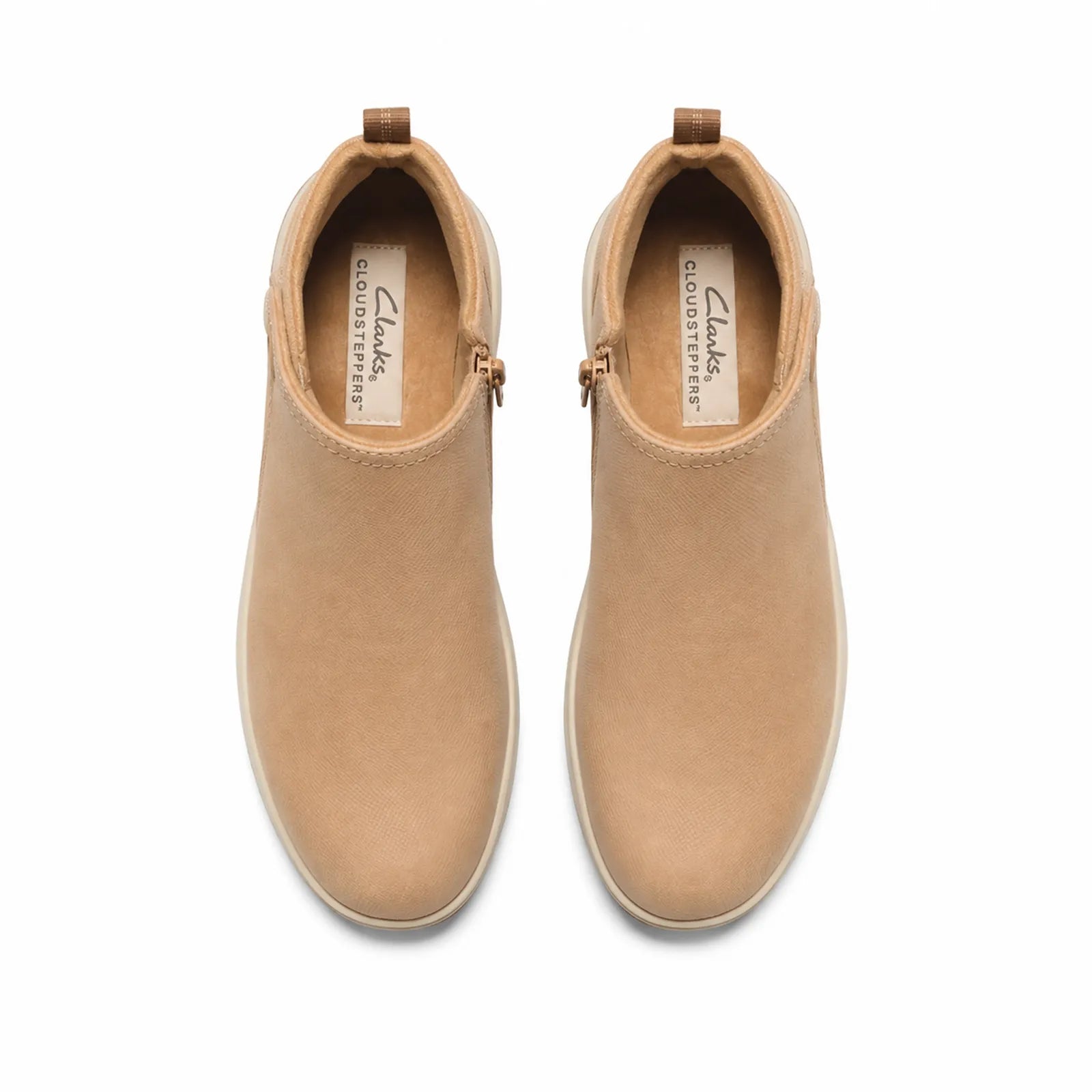 Pair of tan ankle boots with side zip, round toe, and cushioned lining