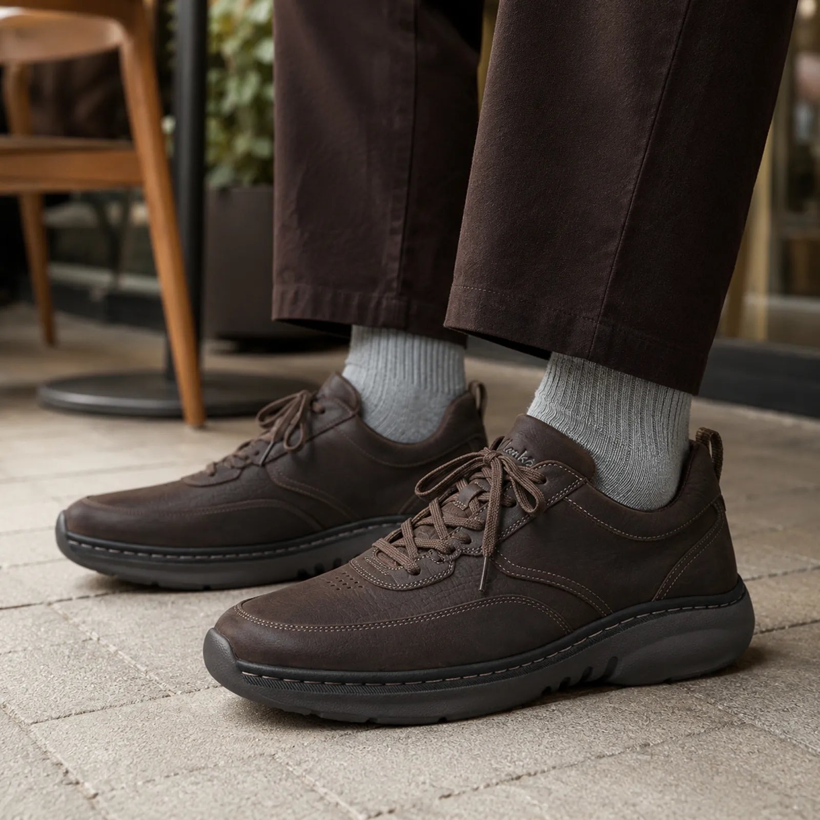 Men's chestnut leather lace-up sneakers with textured outsole and lace detail