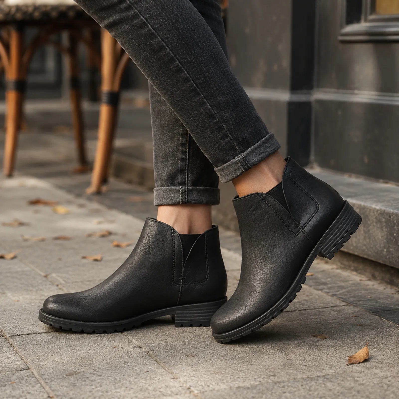 Black leather ankle boots with side gore and chunky tread low heel