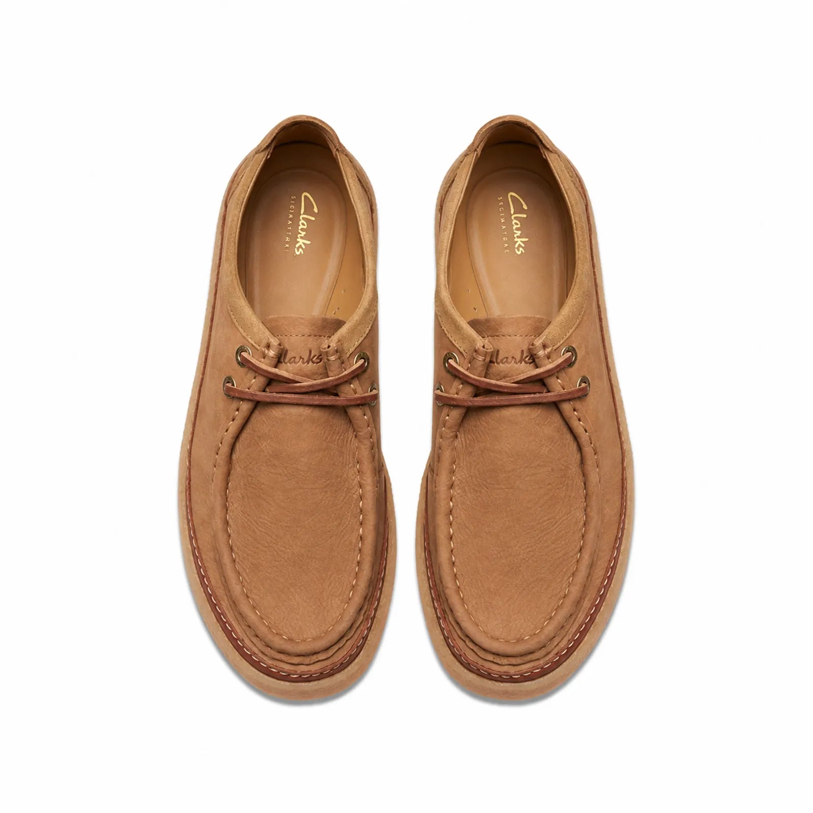 Pair of men's brown suede lace-up loafers, moc toe with tan rubber sole