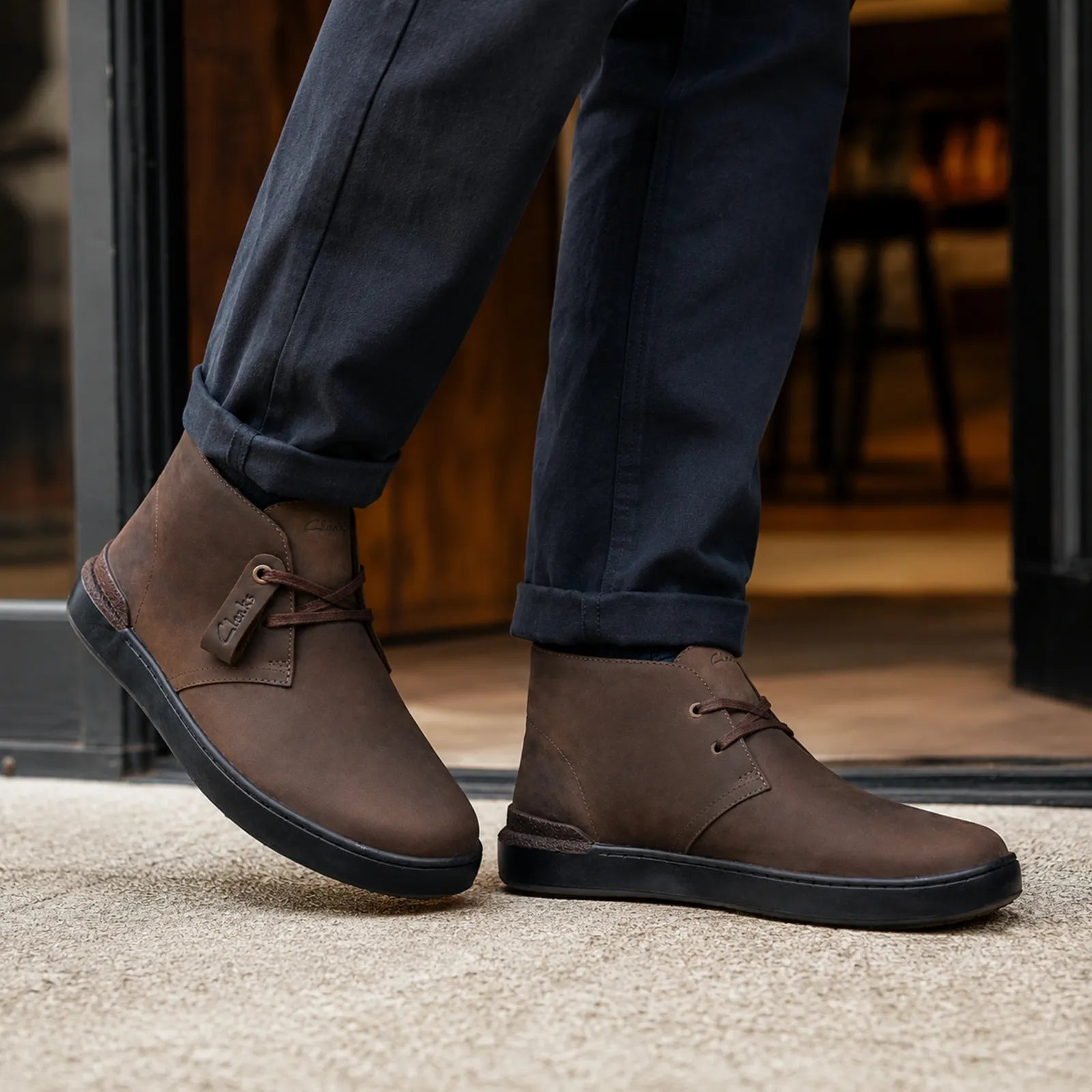 Men's dark brown lace-up chukka sneakers with rubber sole and lace-up strap