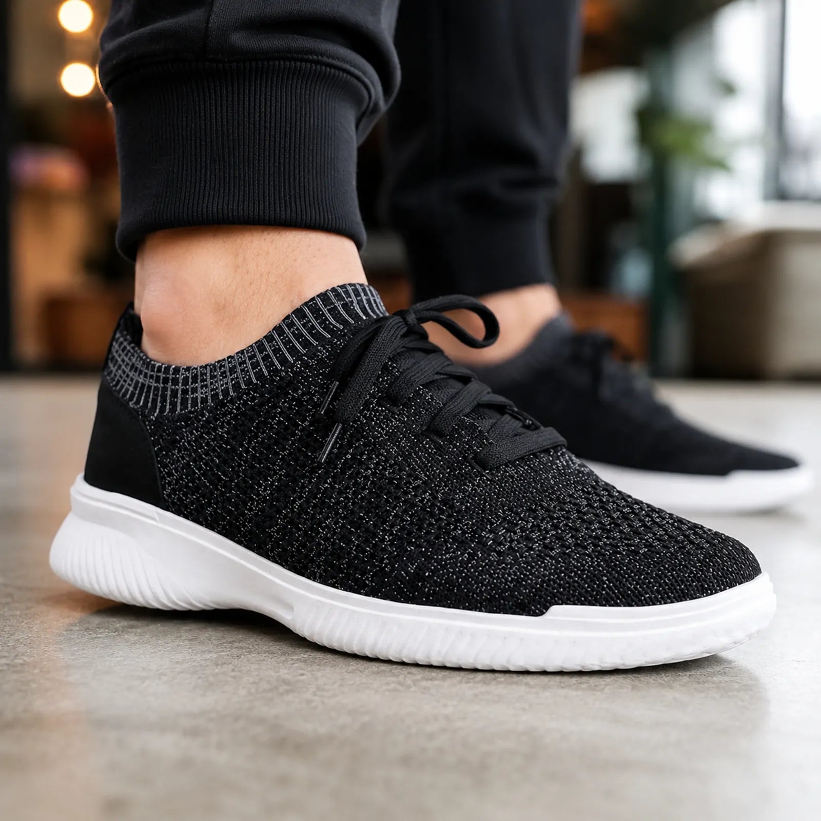 Dark knit lace-up sneakers with textured upper and white rubber midsole