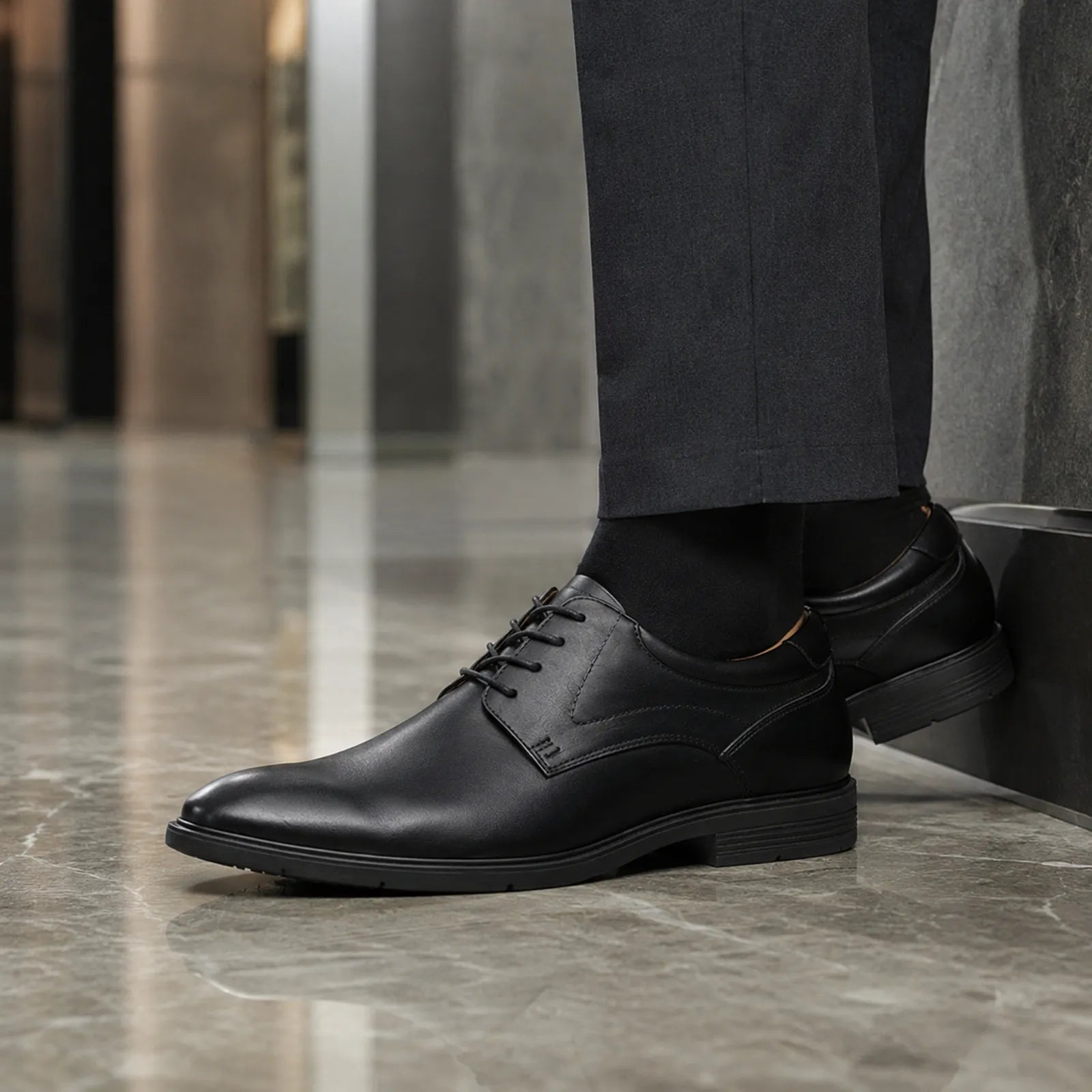 Men's black leather lace-up business shoe with low block heel and rounded toe