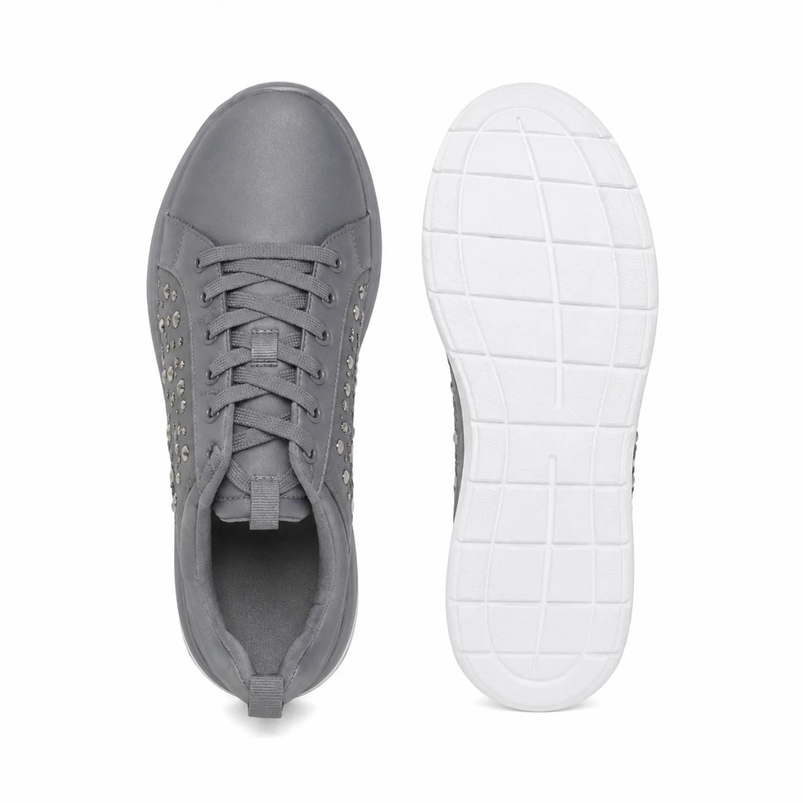 Grey lace-up sneakers showing interior lining and white tread outsole.