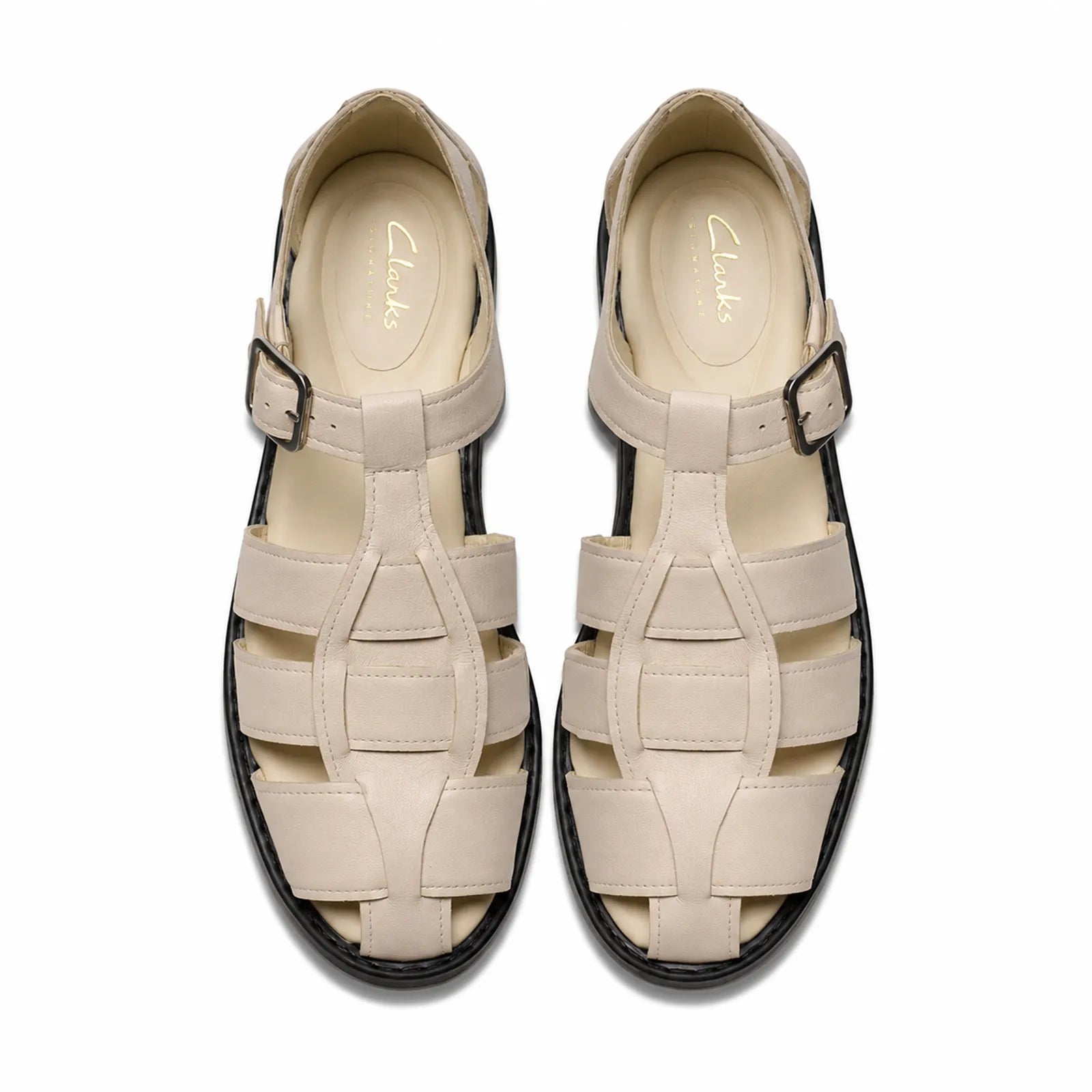 Beige leather sandals pair with ankle buckles and cushioned straps