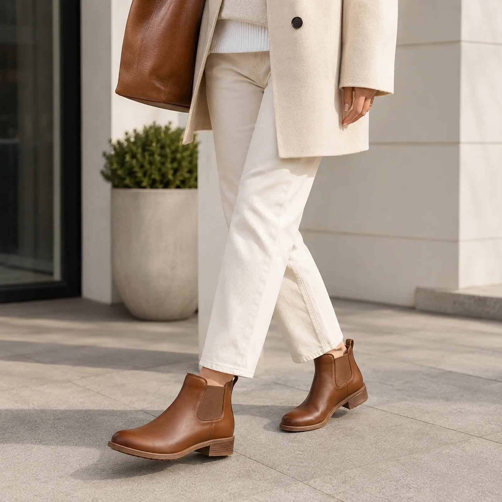 Women's brown leather Chelsea boots with elastic side panels and short block heel