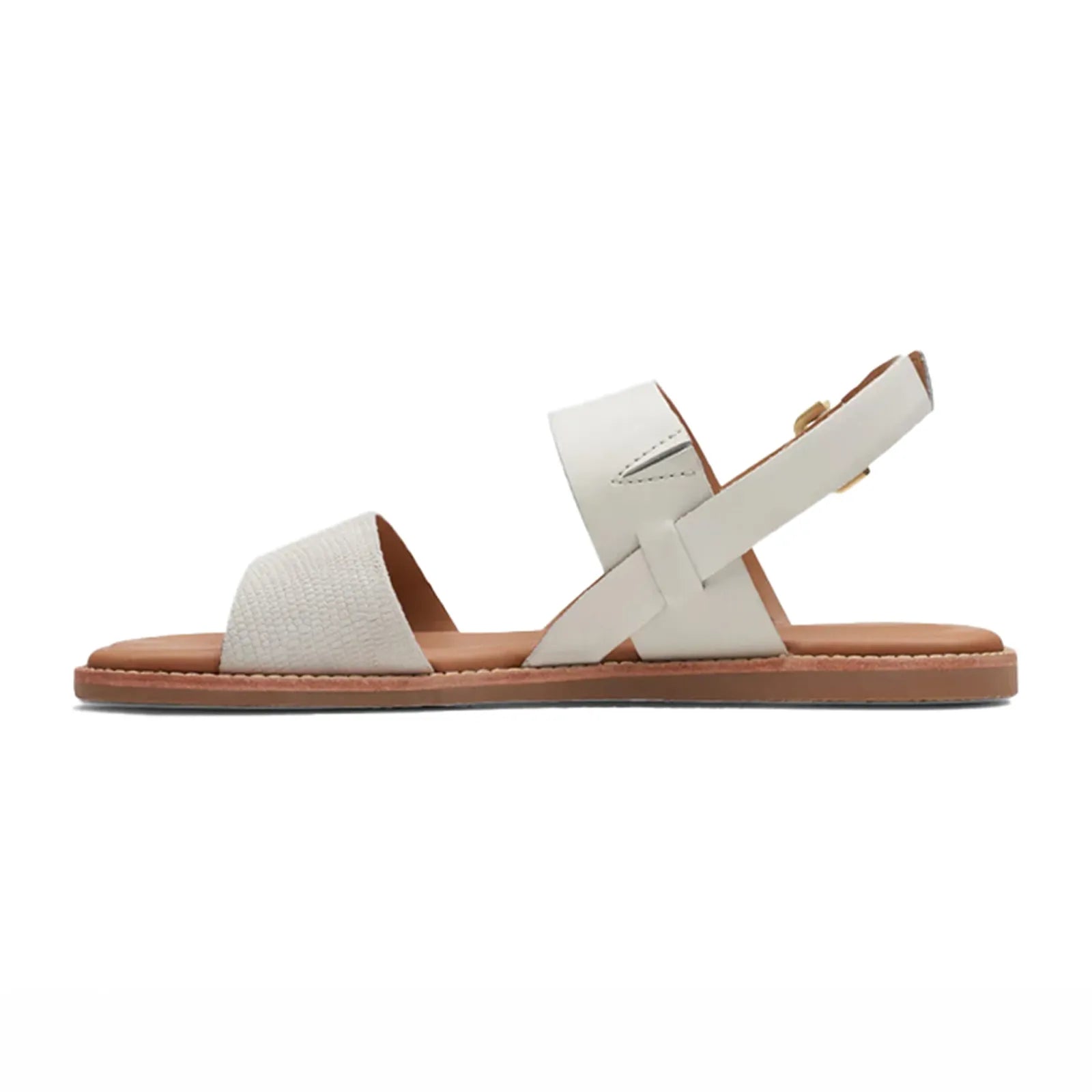 Women's white flat sandals with cross straps and adjustable buckle, tan outsole