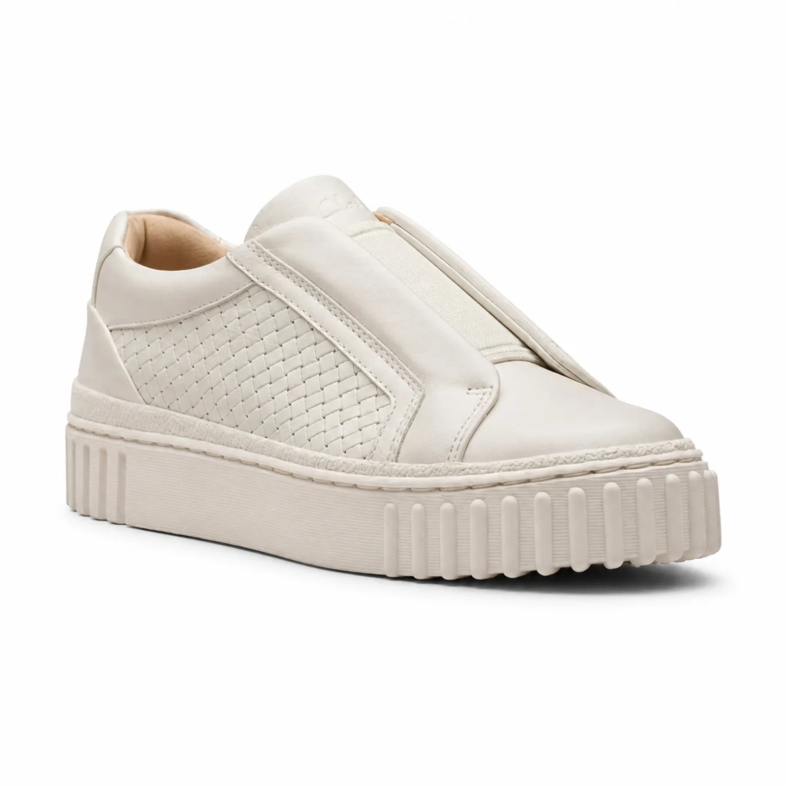 Beige leather slip-on sneakers with textured side panel and thick cushioned sole