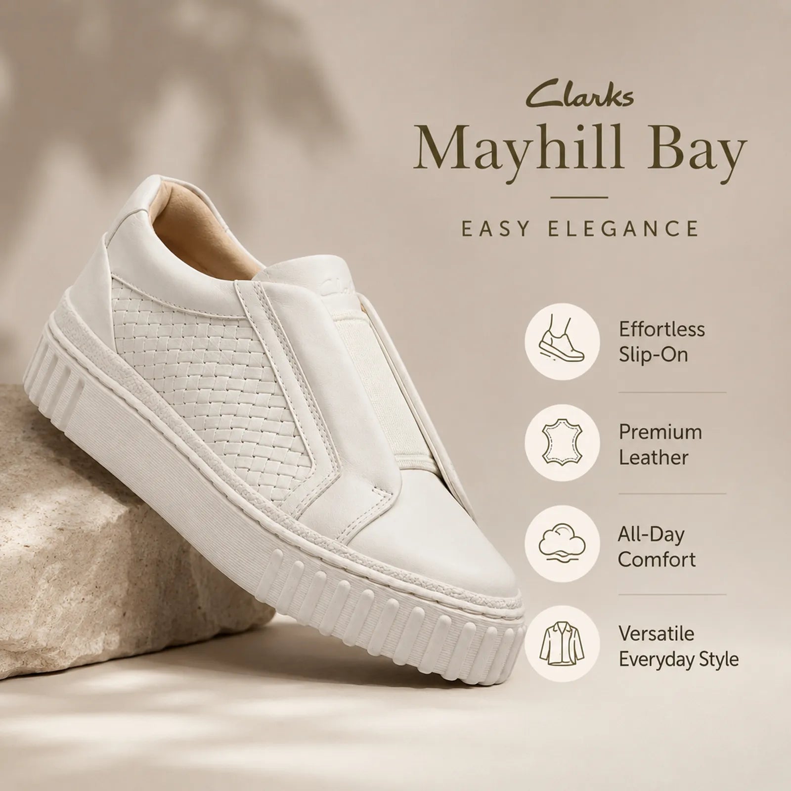 Beige leather slip-on sneakers with textured side panel and thick rubber sole
