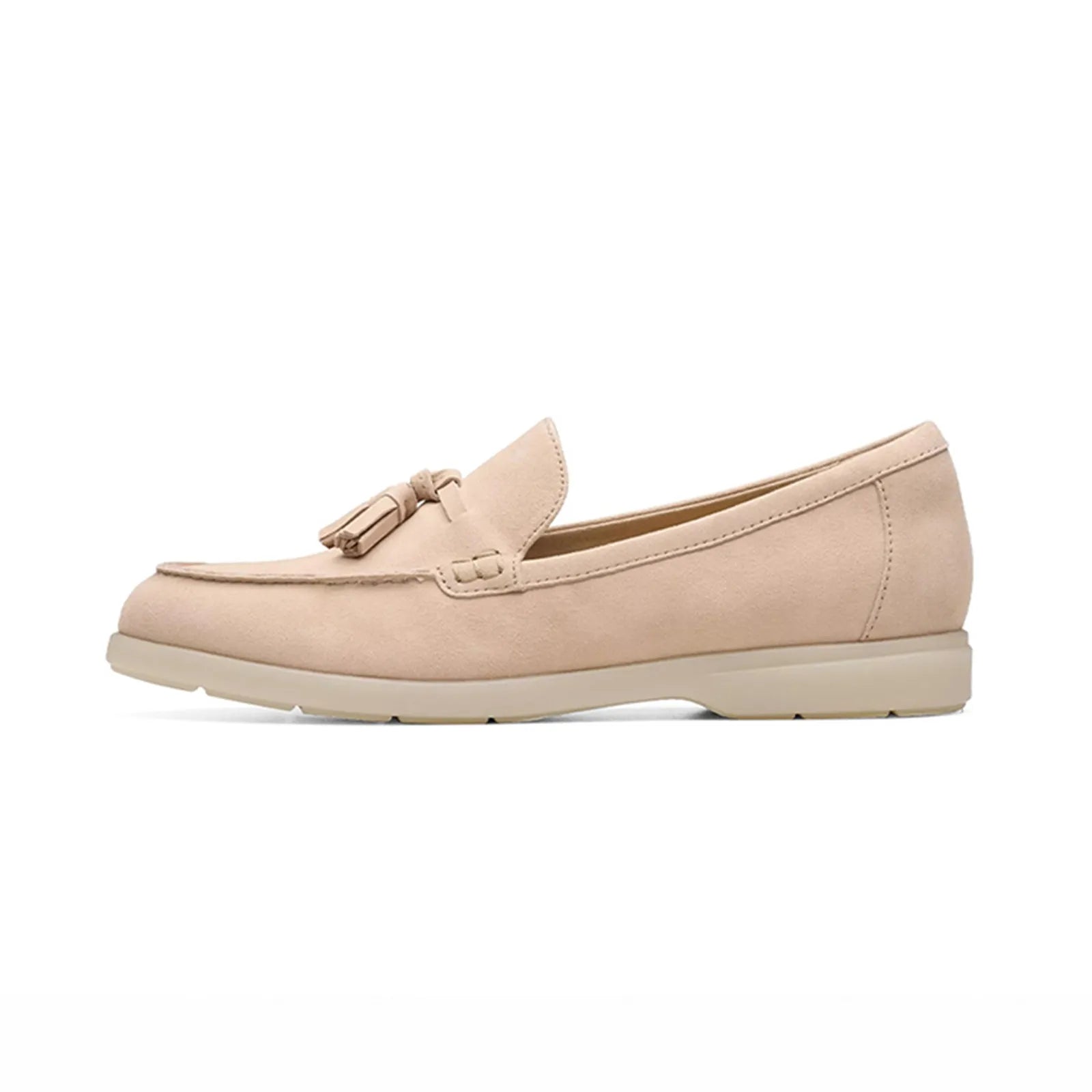 Women's light pink suede loafers, side view with tassel detail and stitched trim