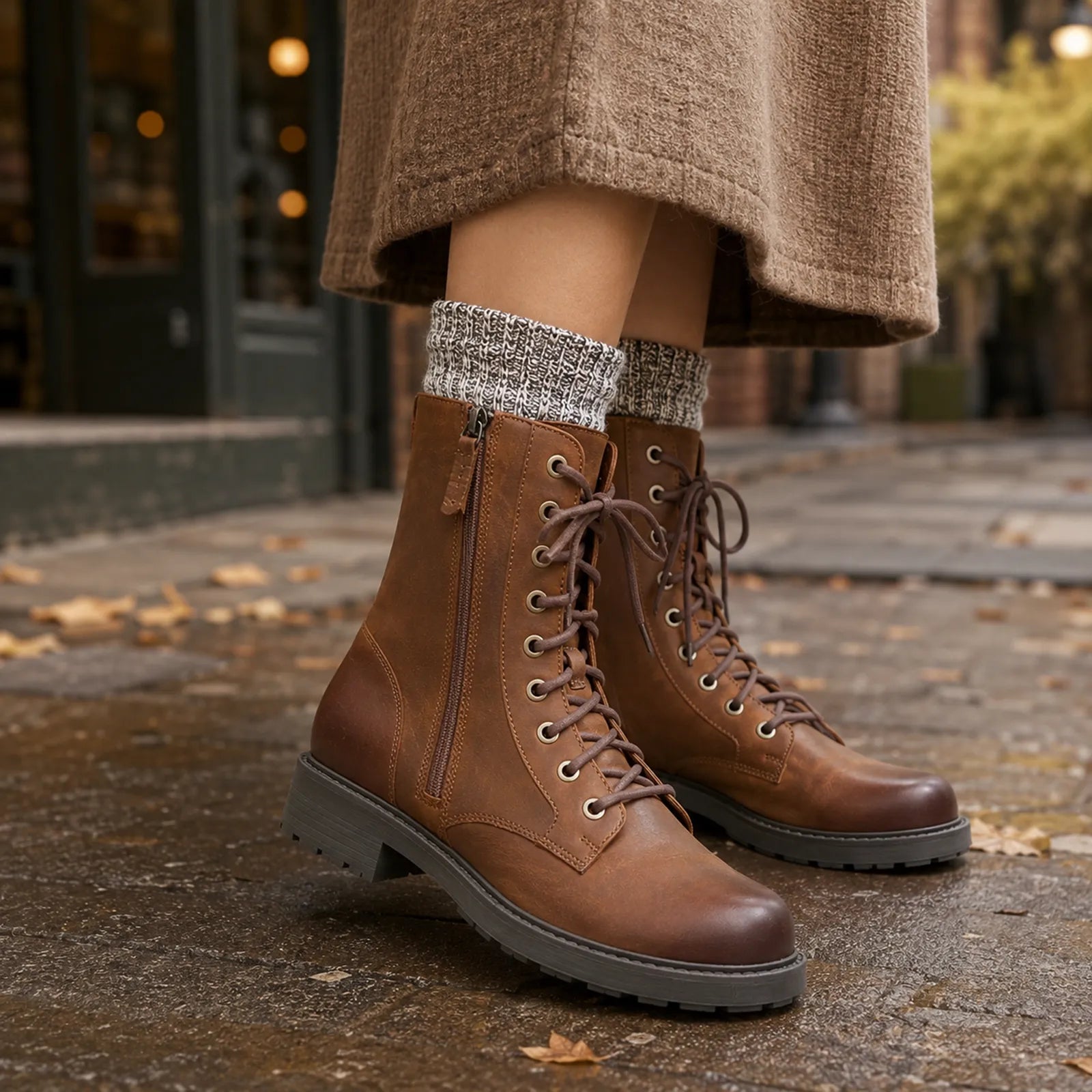Brown leather lace-up ankle boots with side zipper and rugged tread sole