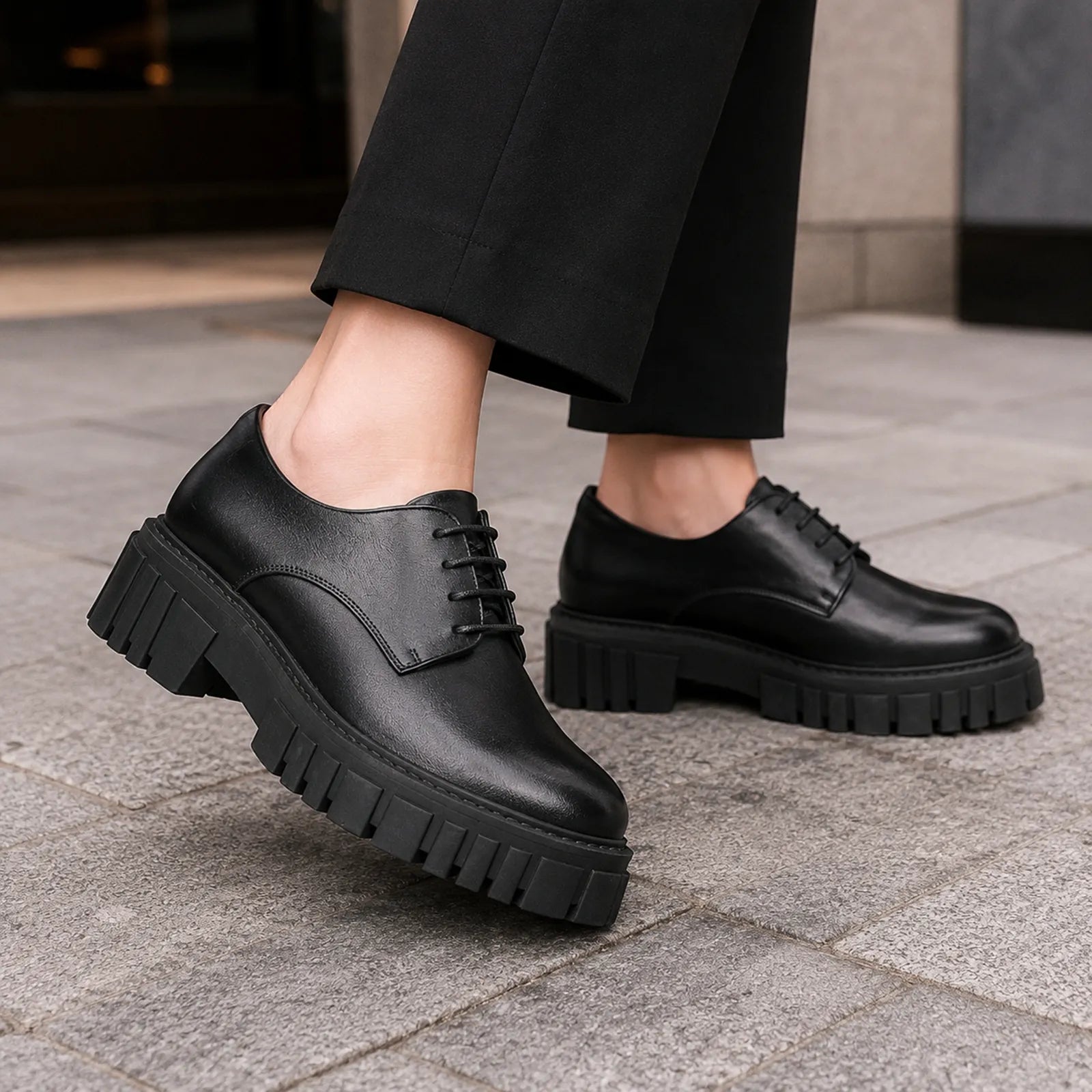 Women's black leather lace-up shoes with chunky lug sole