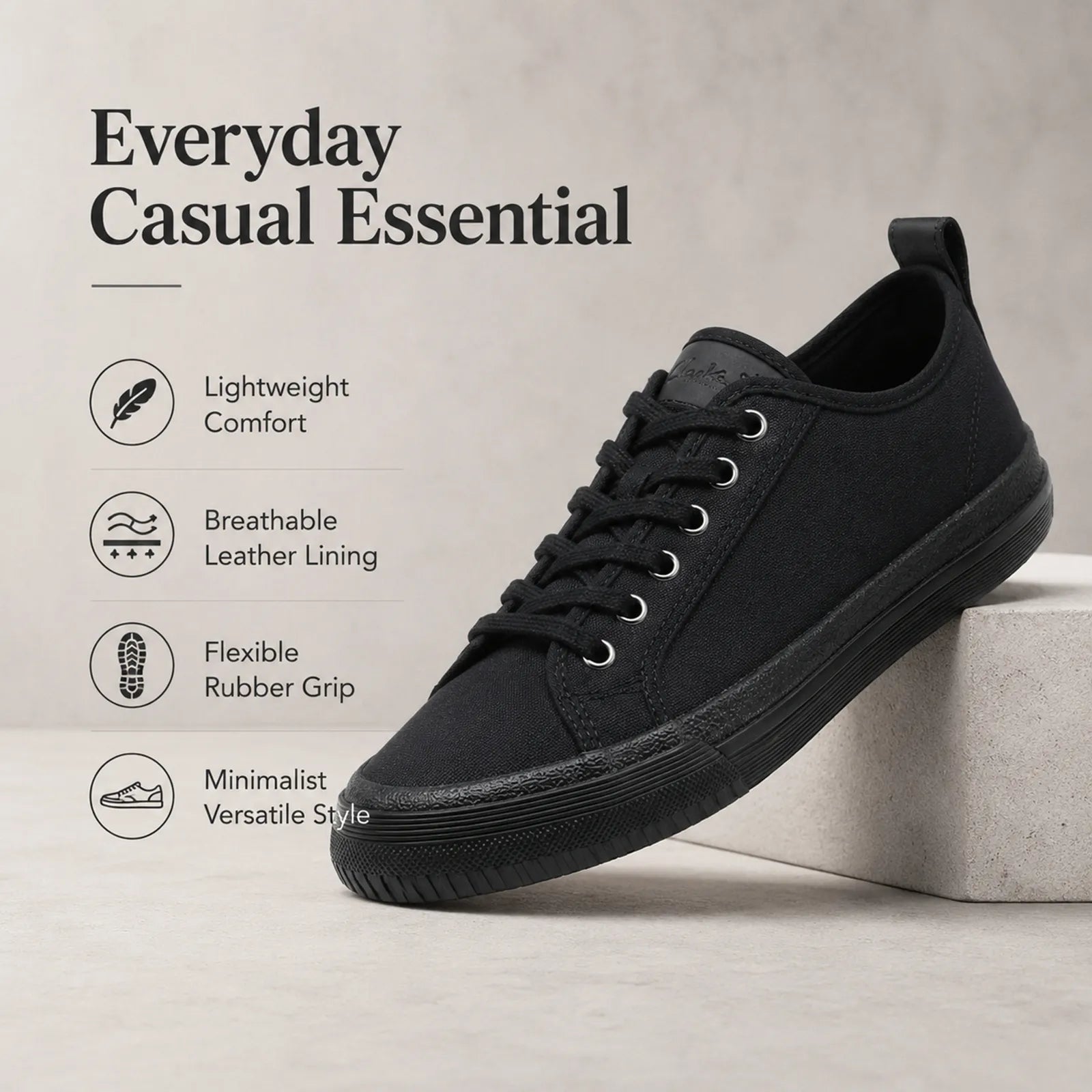 Black casual lace-up sneakers with padded collar and flexible rubber grip sole