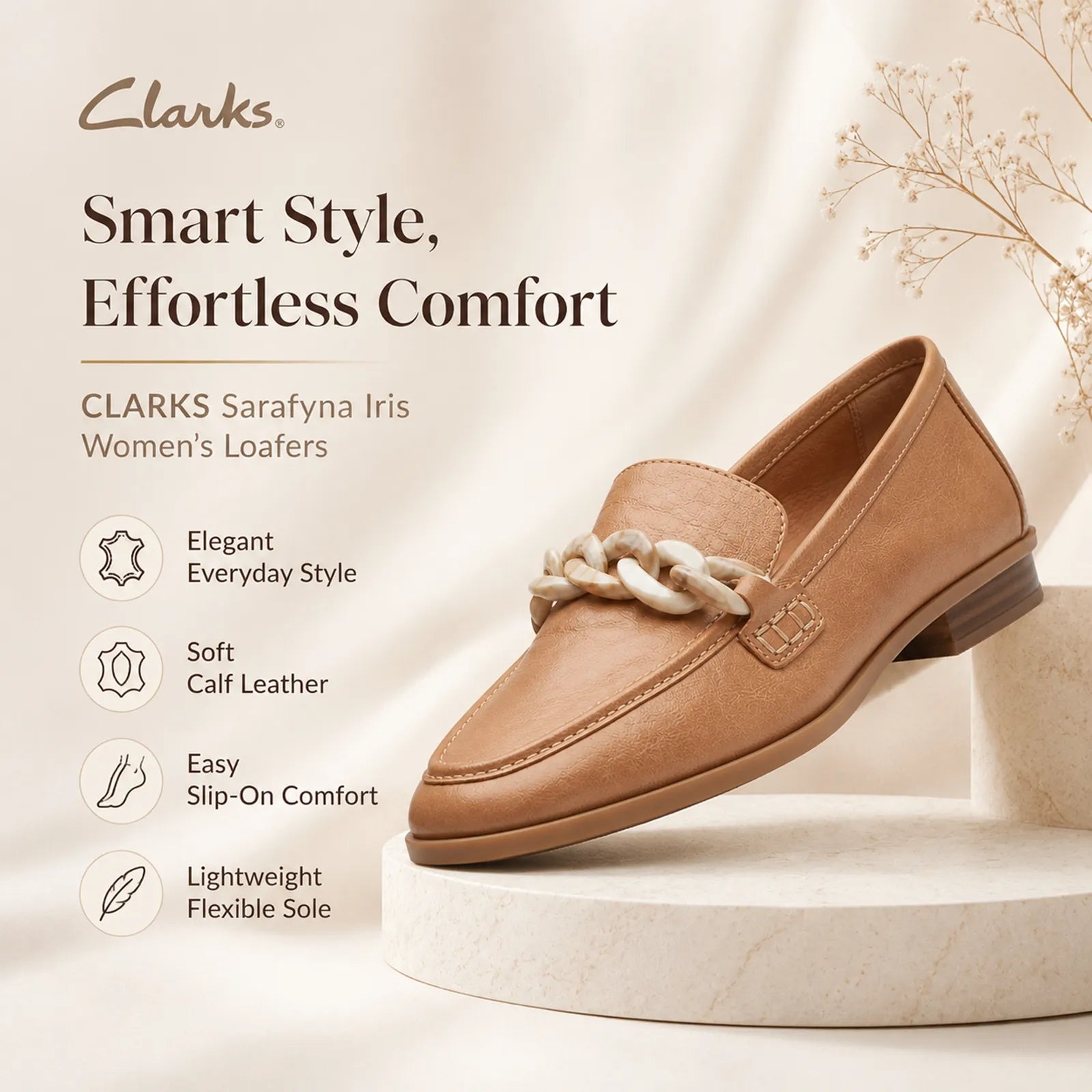 Camel tan leather loafers with braided chain ornament and low block heel.