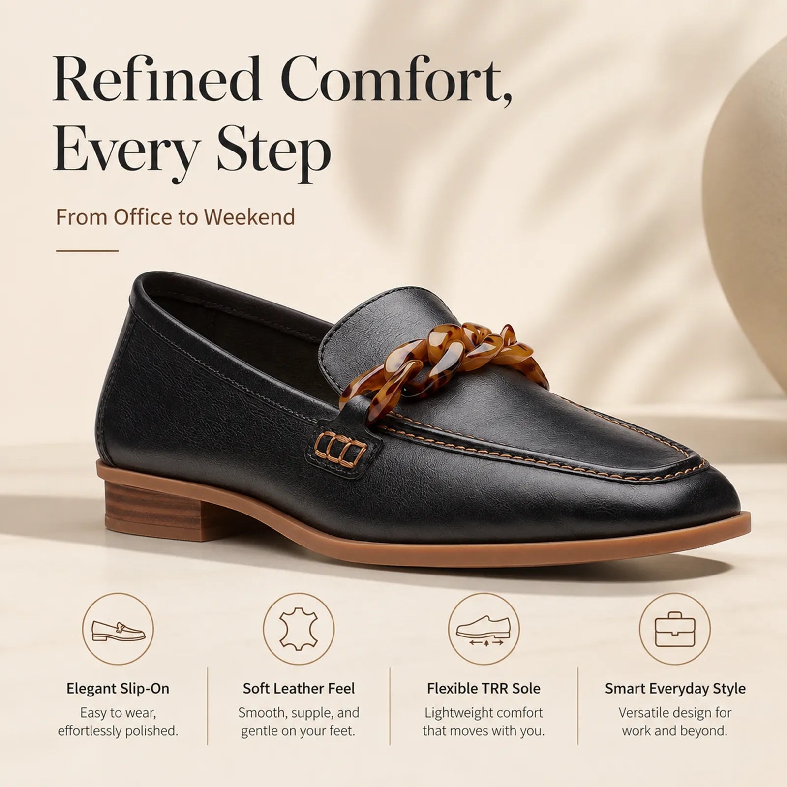Women's black leather loafer front view with braided chain bit and low block heel