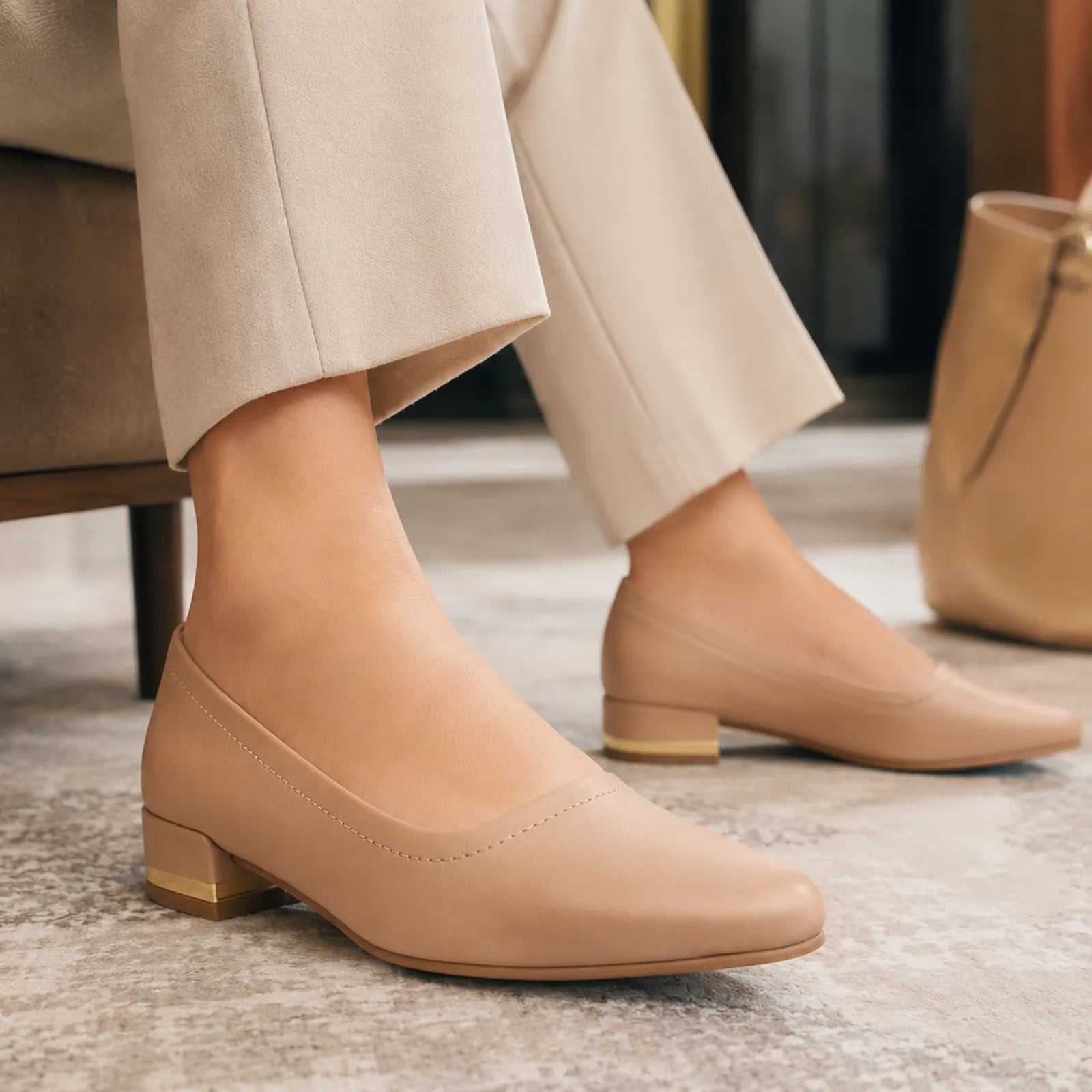 Beige women's low block heel court pumps, side profile with rounded toe