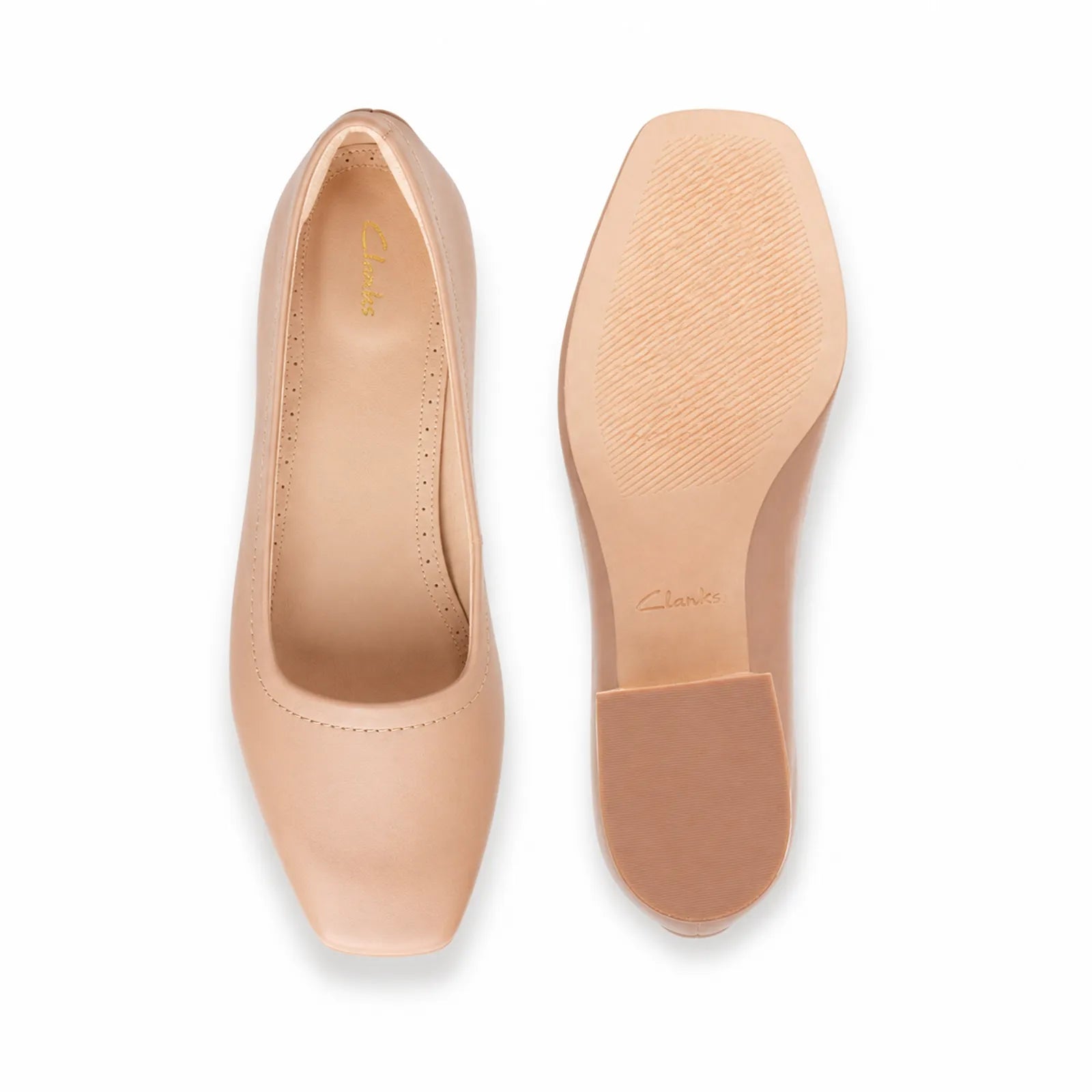 Beige women's court pumps, rounded toe upper and textured rubber sole underside
