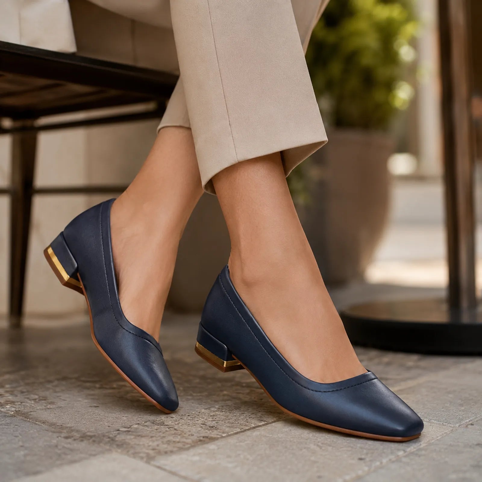Women's court pumps, dark blue leather with low block heel and gold-tone accent