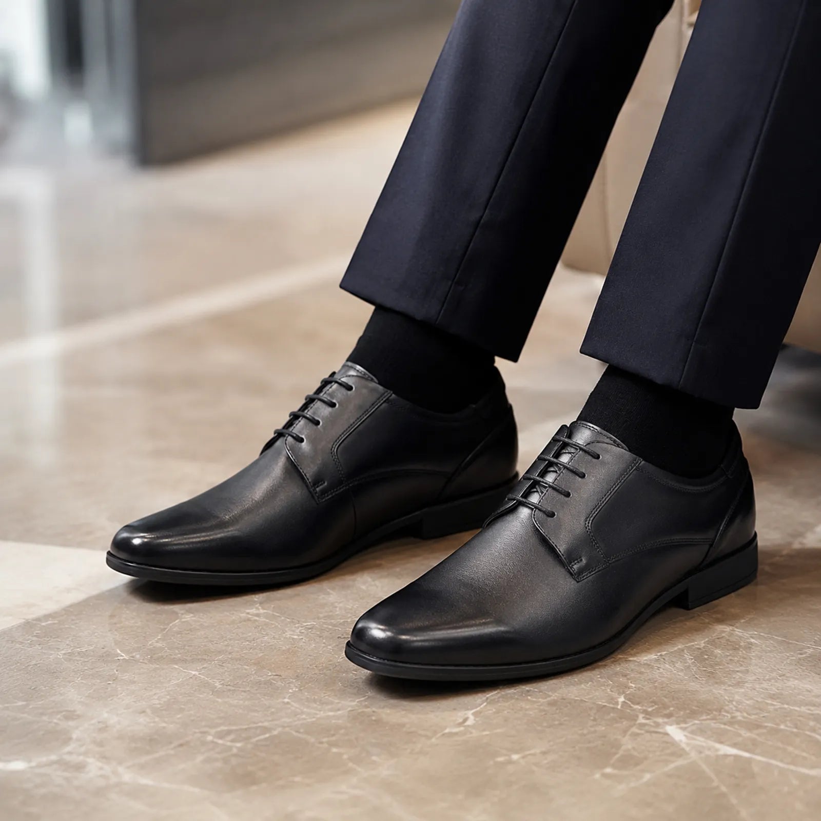 Men's black leather lace-up business shoes with stitched panels and rubber sole