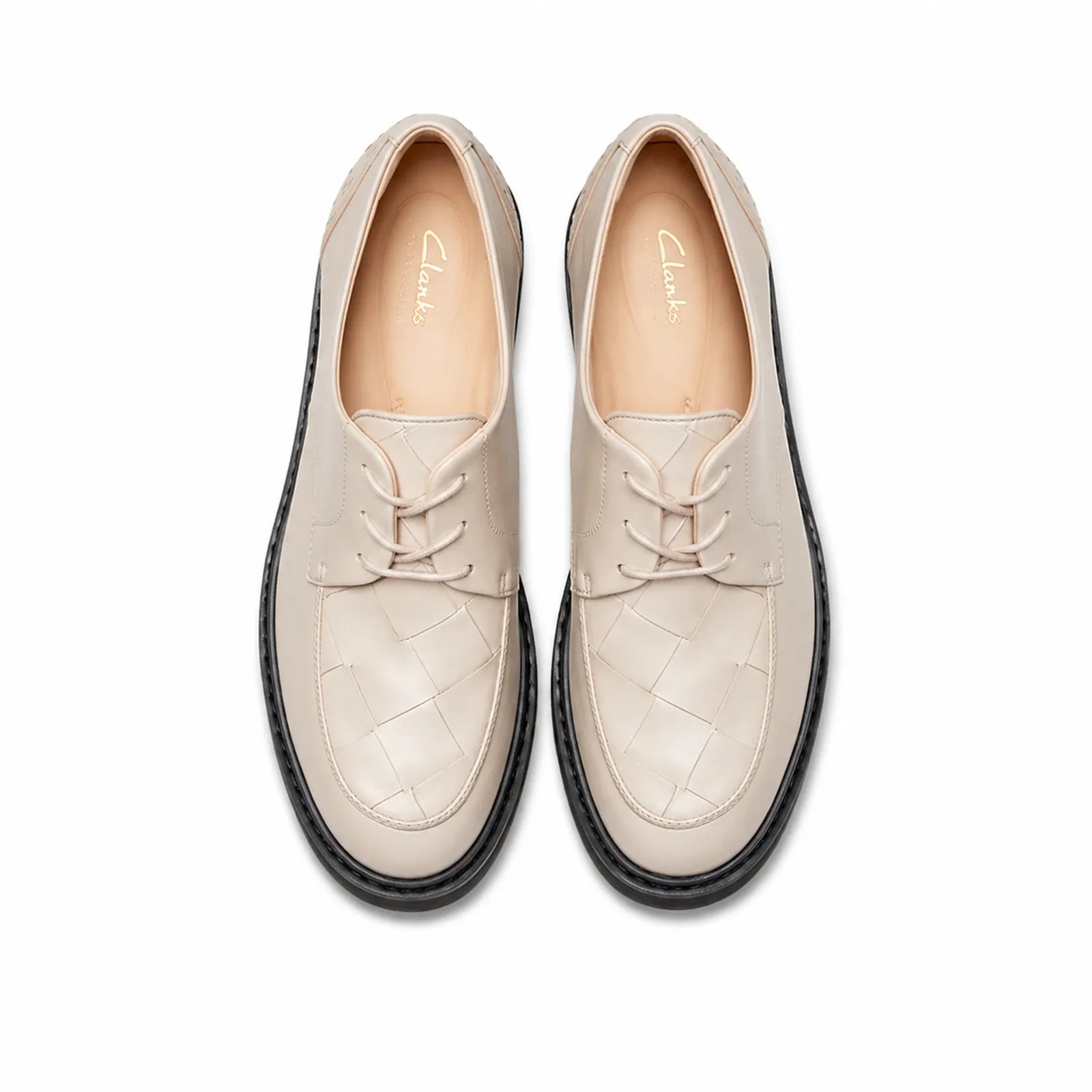 Women’s white leather lace-up business shoes, two-quarter view showing black sole trim