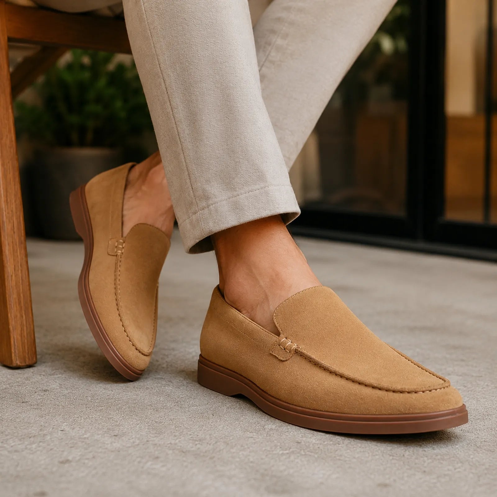 Men's suede slip-on loafers, tan-brown with moc toe stitching and cushioned-looking sole
